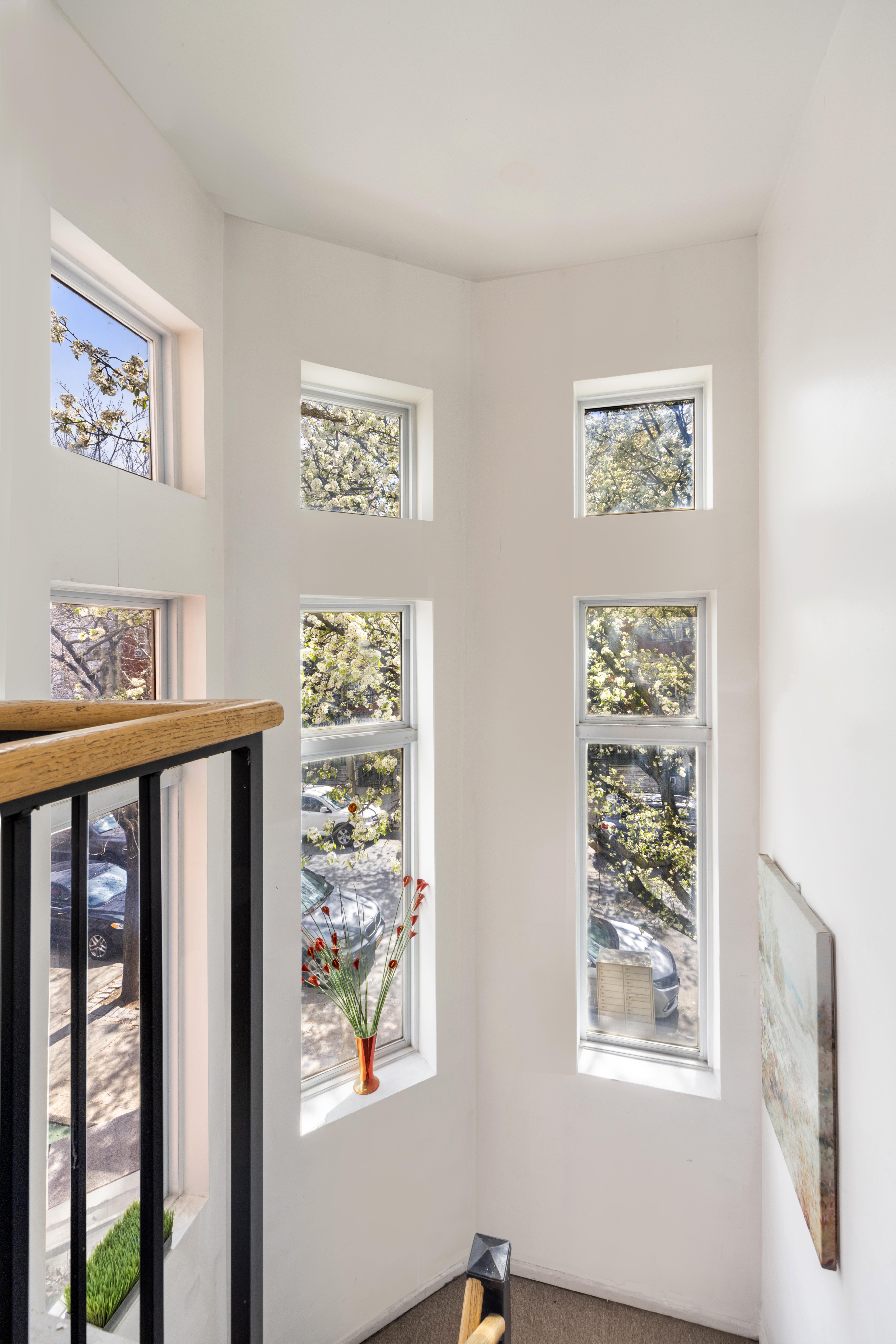125 West 117th Street Manhattan, NY 10026 - Photo 9 of 23 a view of a hallway with windows and a large window