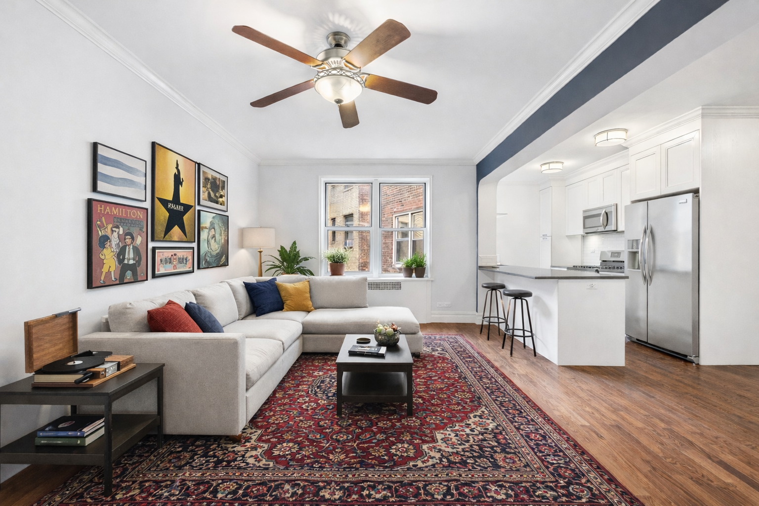 a living room with furniture fireplace and a window