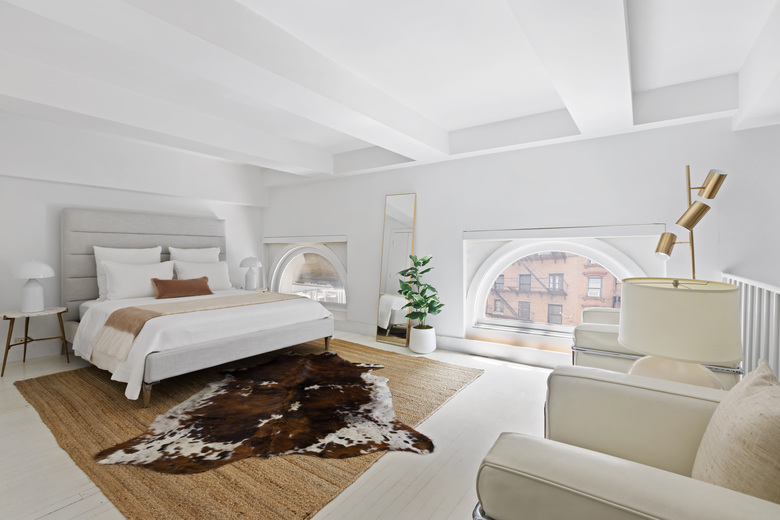 240 Centre Street, Unit 2J Manhattan, NY 10013 - Photo 12 of 18 a bedroom with a large bed and a couch