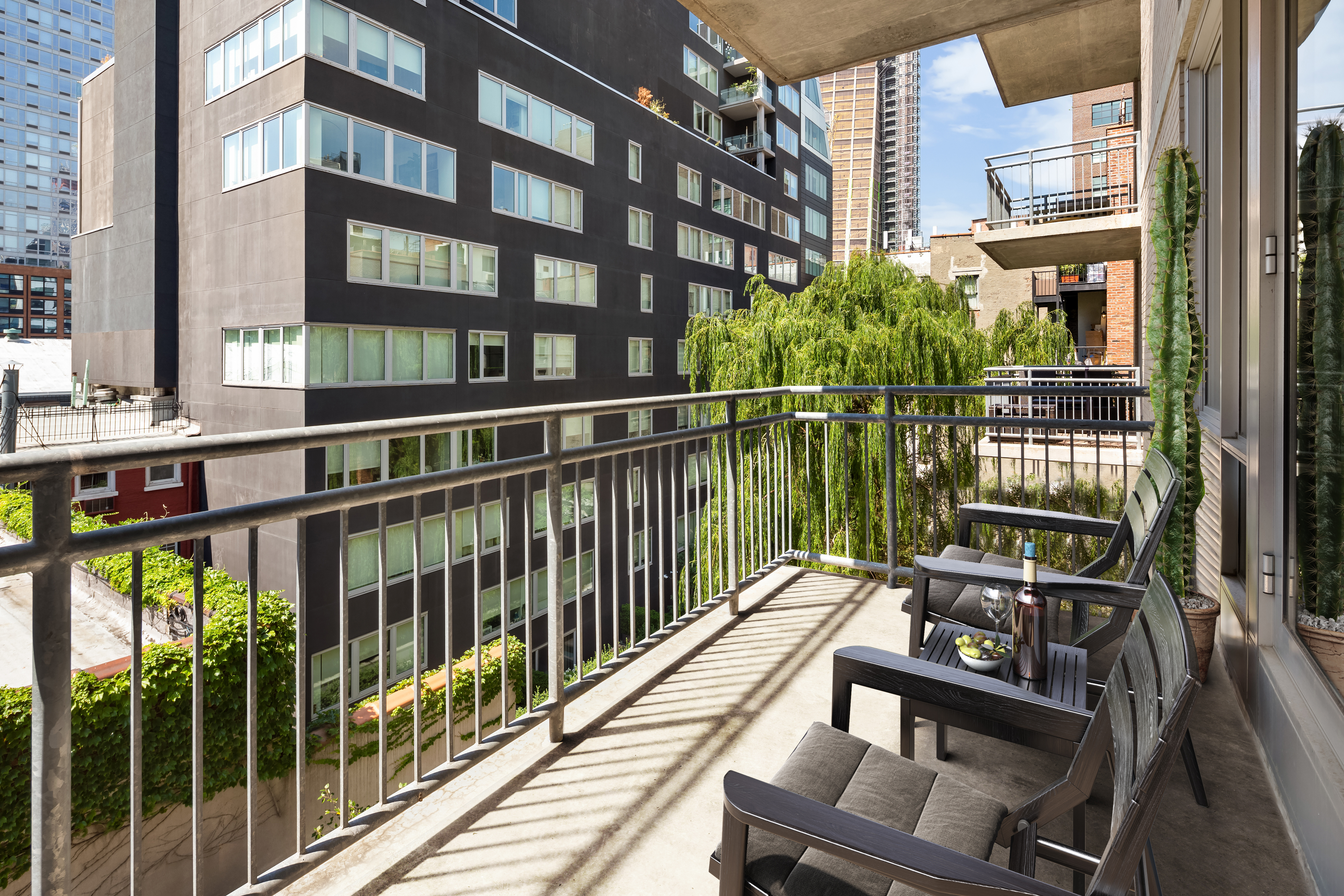 444 West 19th Street, Unit 403 Manhattan, NY 10011 - Photo 2 of 6 a view of a balcony with wooden floor