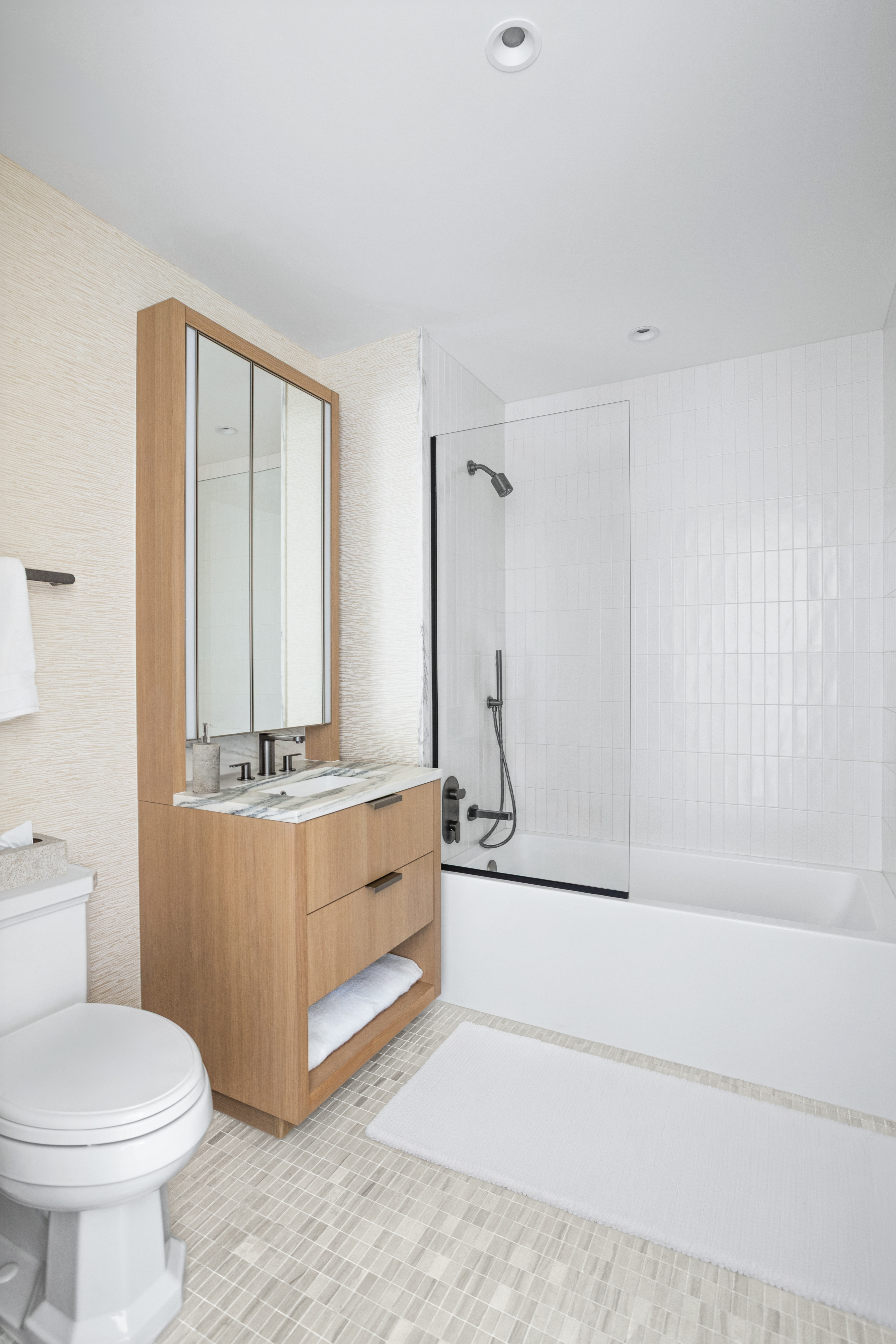 543 West 122nd Street, Unit PH31A Manhattan, NY 10027 - Photo 29 of 40 a bathroom with a tub a toilet and a sink