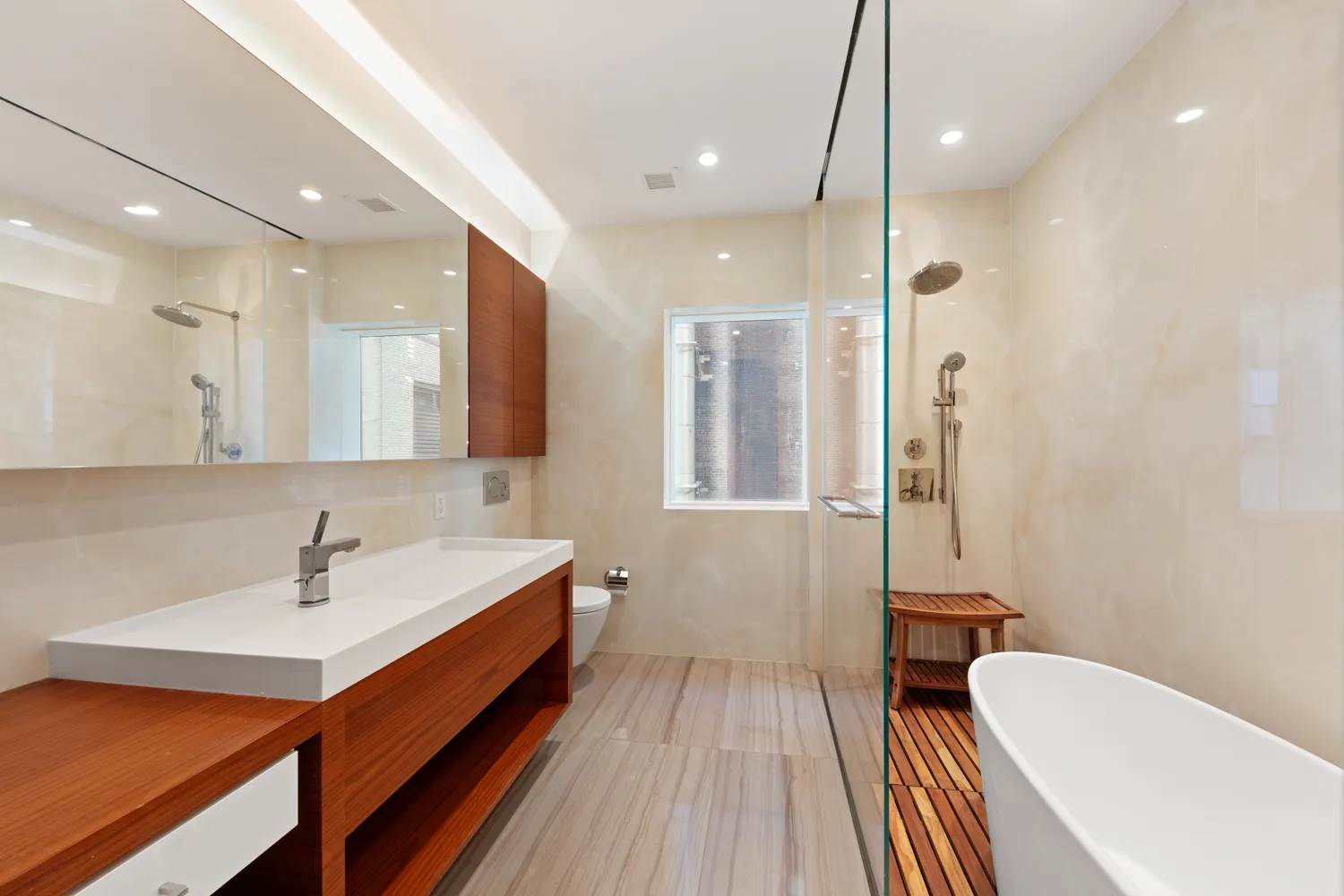 a bathroom with a double vanity sink a mirror and a shower