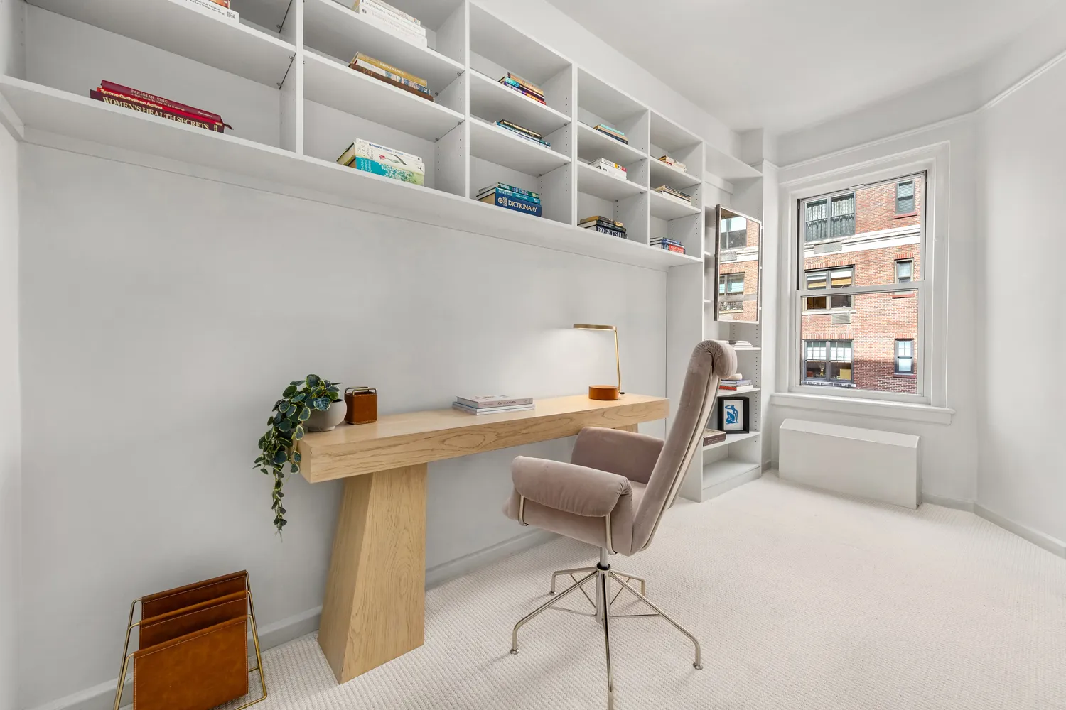 a reading room with furniture and wooden floor