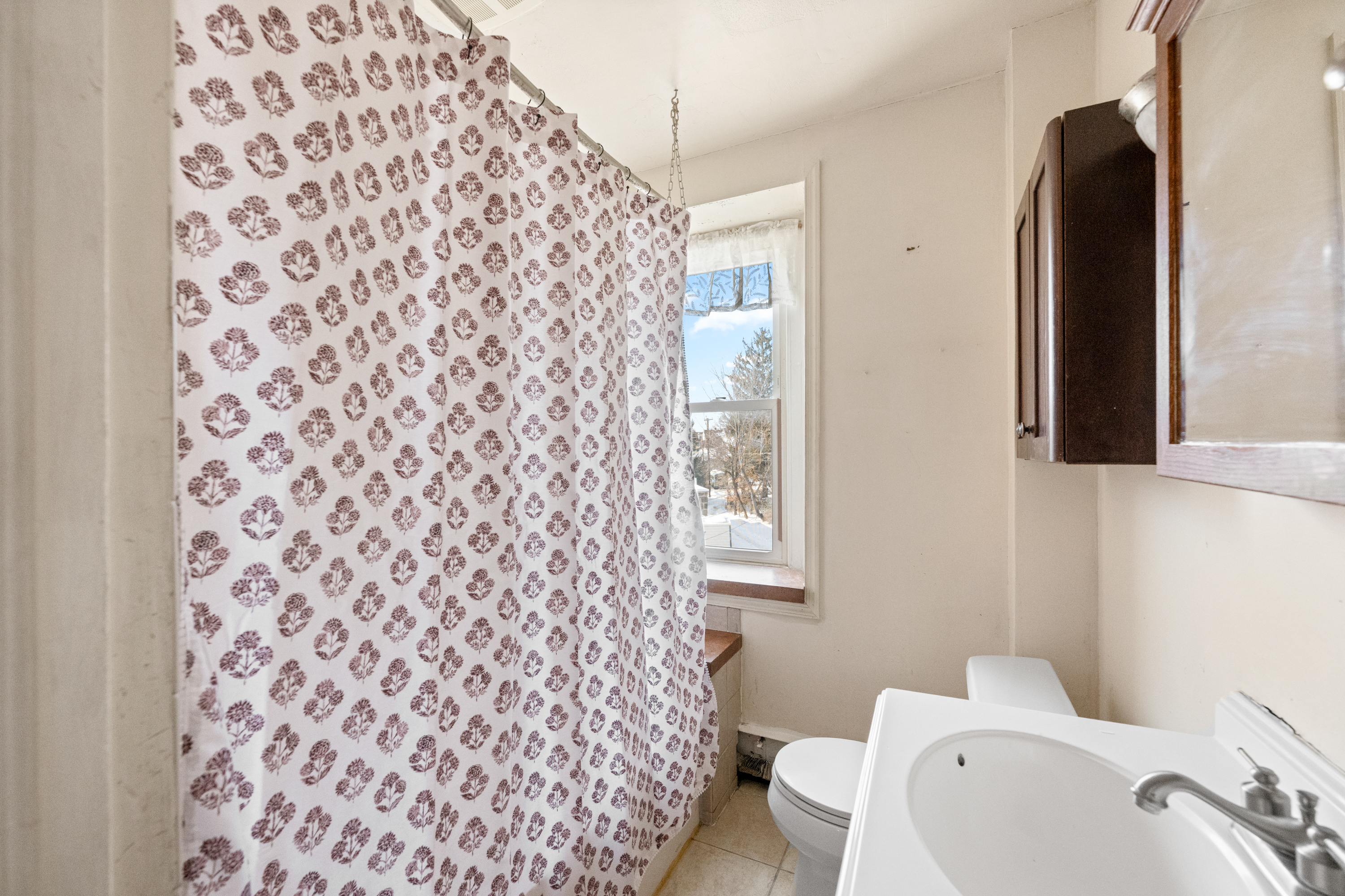 458 Renfrew Avenue Ambler, PA 19002 - Photo 28 of 32 a bathroom with a toilet and a shower curtain