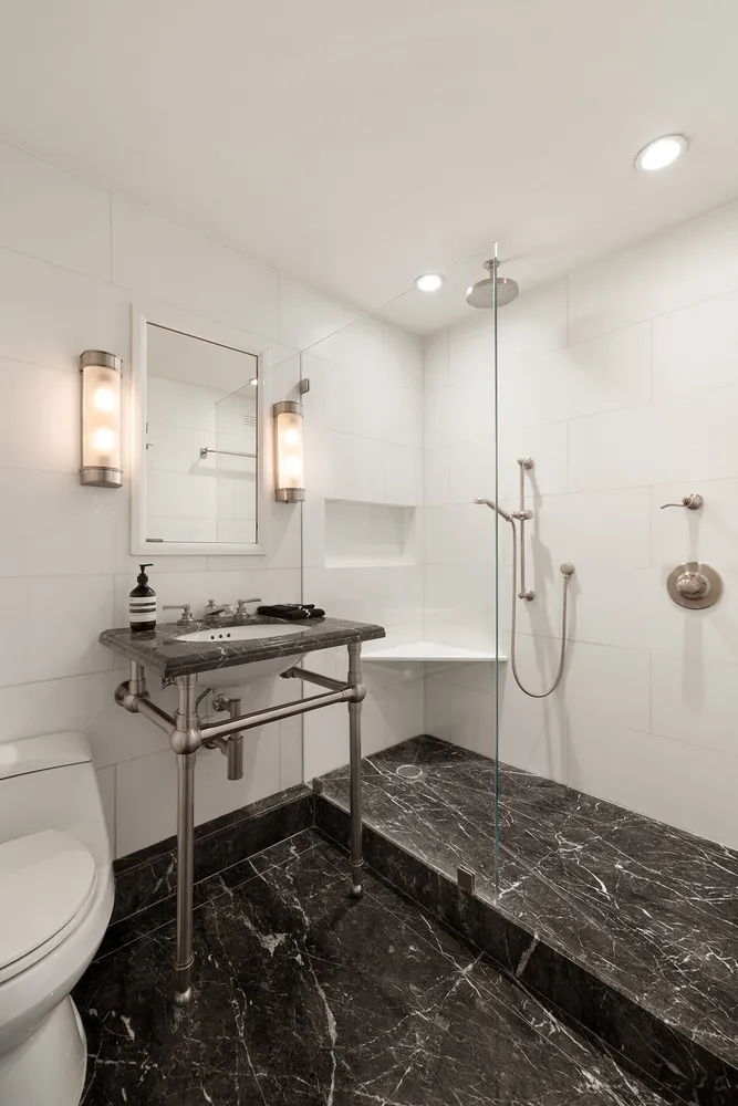 a kitchen with stainless steel appliances granite countertop a stove and a microwave