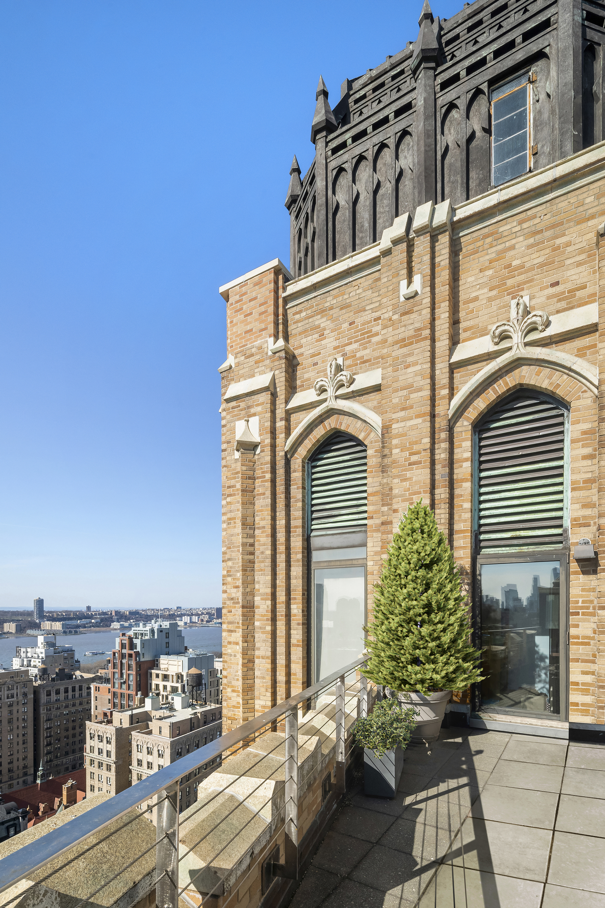2166 Broadway, Unit PH Manhattan, NY 10024 - Photo 23 of 37 a view of a blue building with large windows