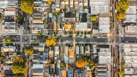 an aerial view of residential houses with outdoor space