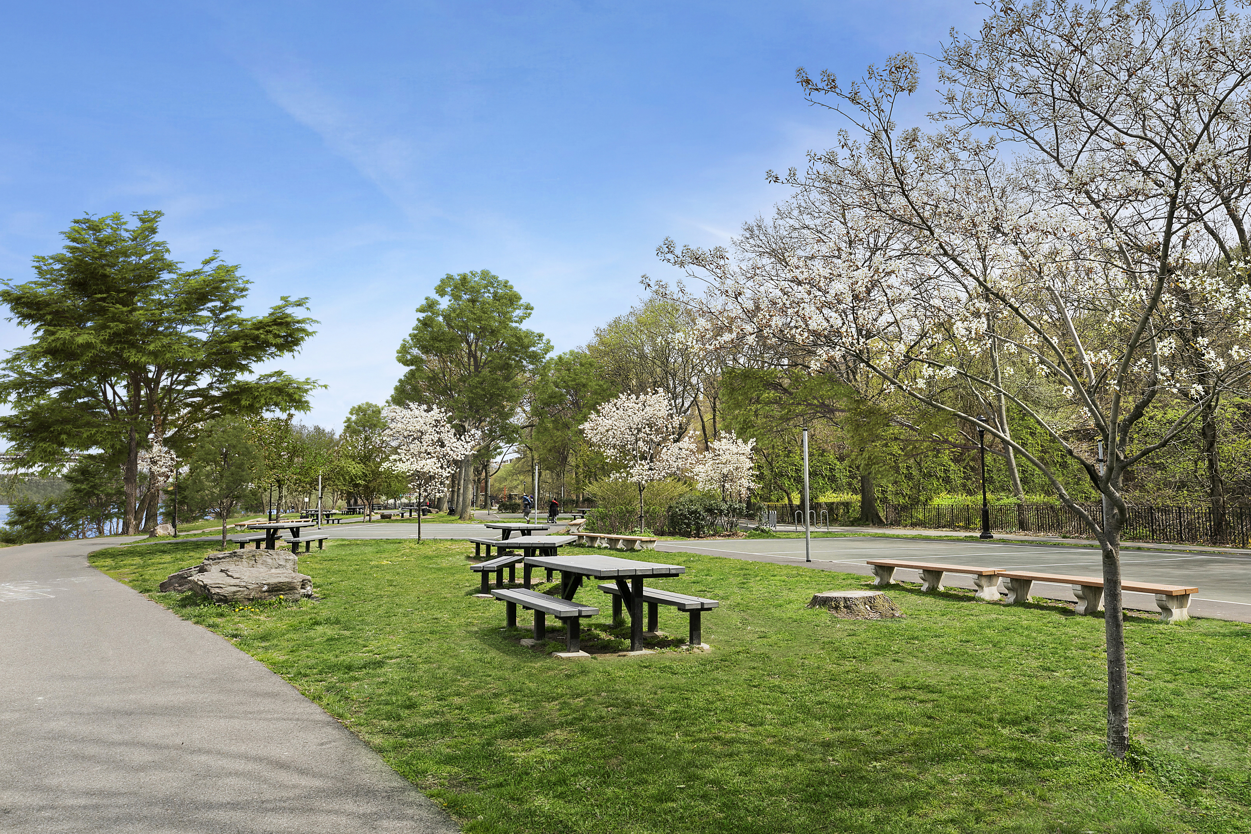 159-34 Riverside Drive West, Unit 1J90 Manhattan, NY 10032 - Photo 18 of 19 a garden view with a bench