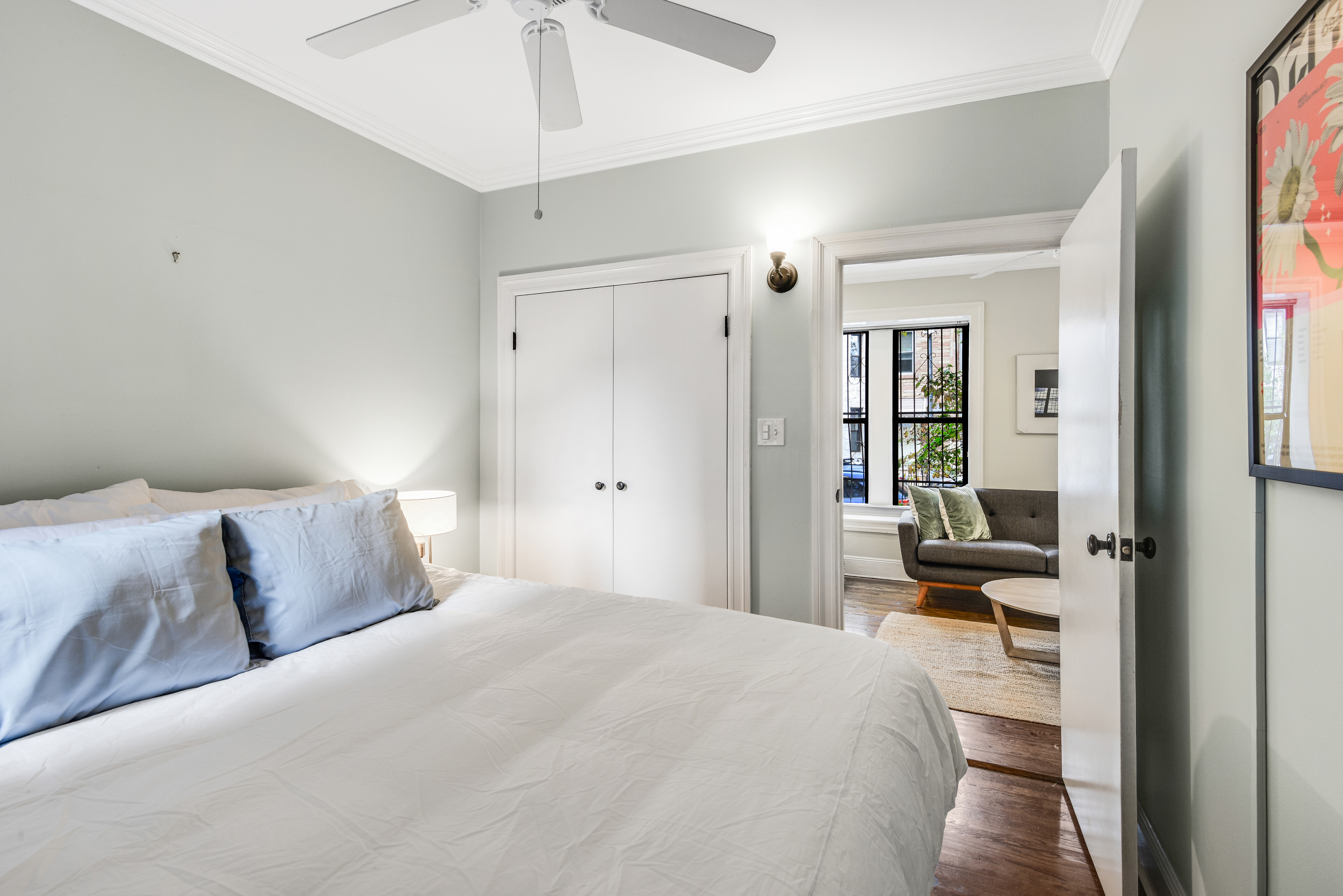 322 6th Street, Unit 2 Brooklyn, NY 11215 - Photo 5 of 11 a bedroom with a large bed and a chandelier