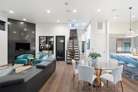 a view of a dining room with furniture window and wooden floor