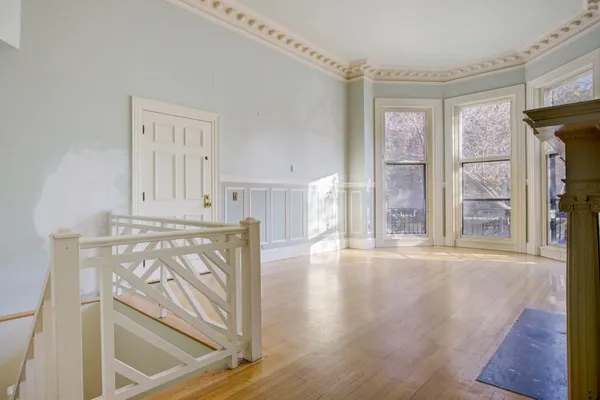 a view of an entryway with wooden floor