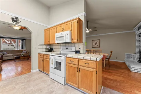 a kitchen with a stove a sink and a refrigerator