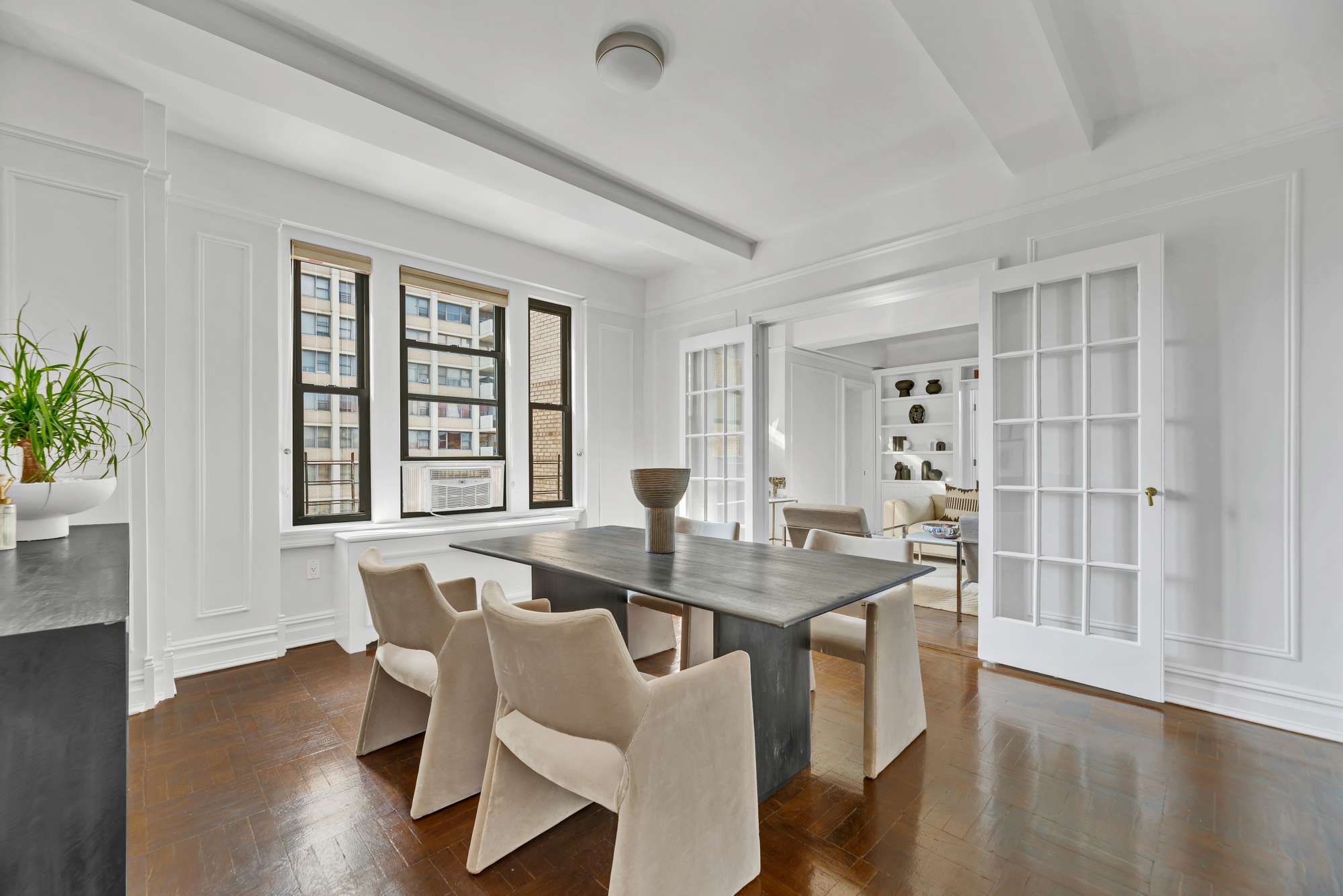 41 West 96th Street, Unit 15D Manhattan, NY 10025 - Photo 5 of 13 a dining room with furniture and wooden floor