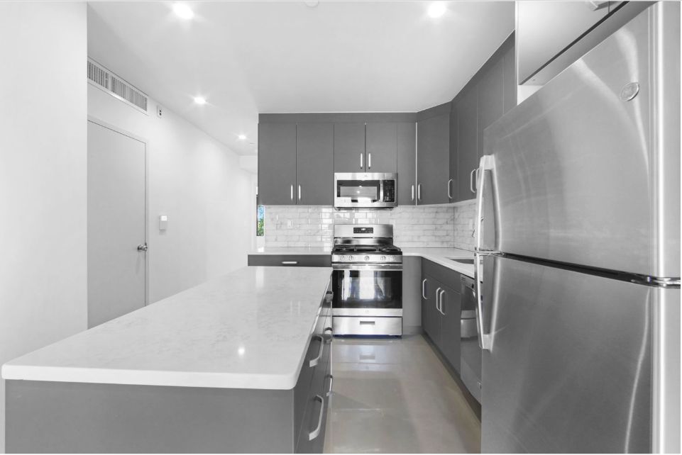 278 Warren Street, Unit 4 Brooklyn, NY 11201 - Photo 2 of 8 a kitchen with stainless steel appliances a refrigerator sink and stove