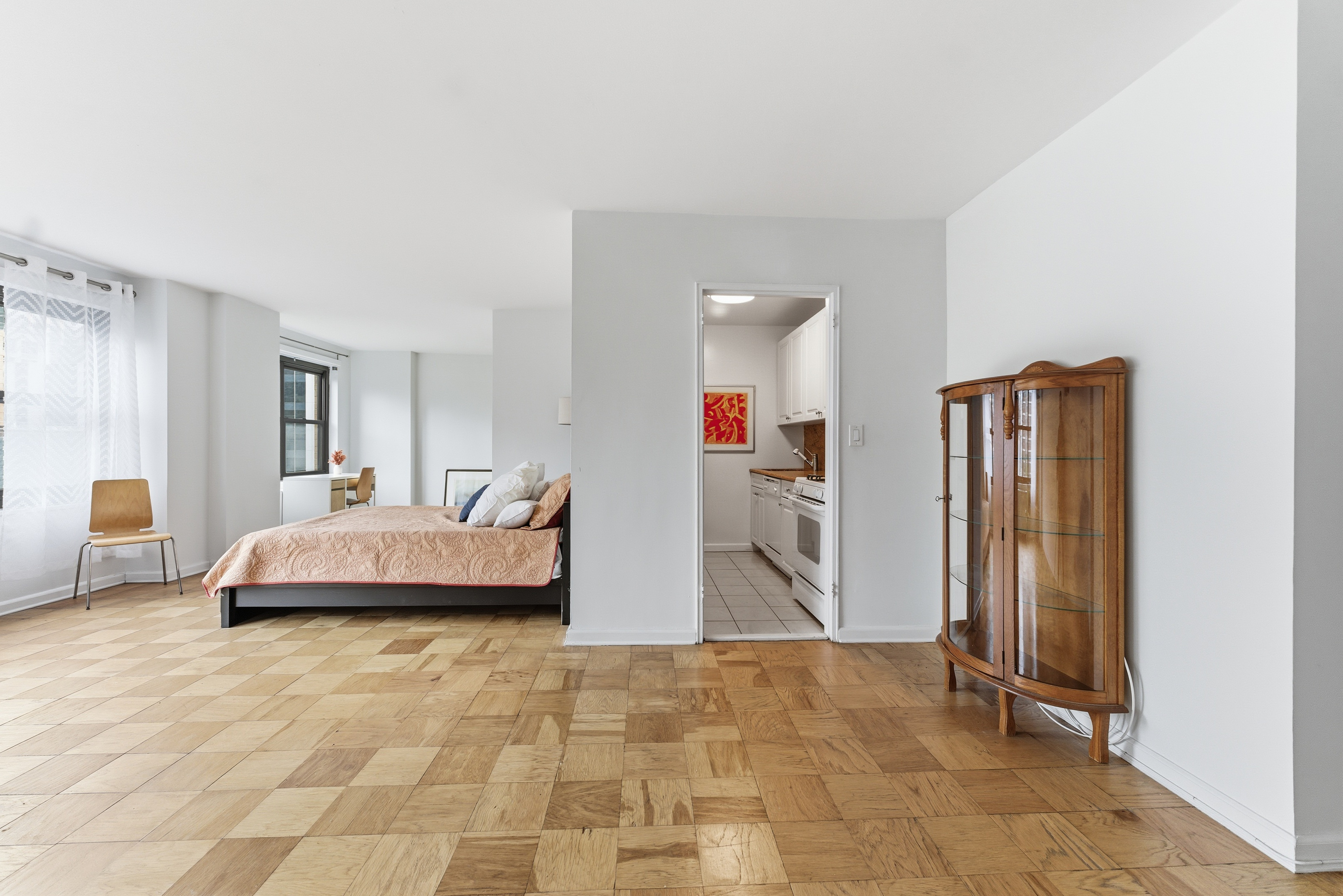 140 West End Avenue, Unit 6D Manhattan, NY 10023 - Photo 2 of 19 a bedroom with a bed and a dresser