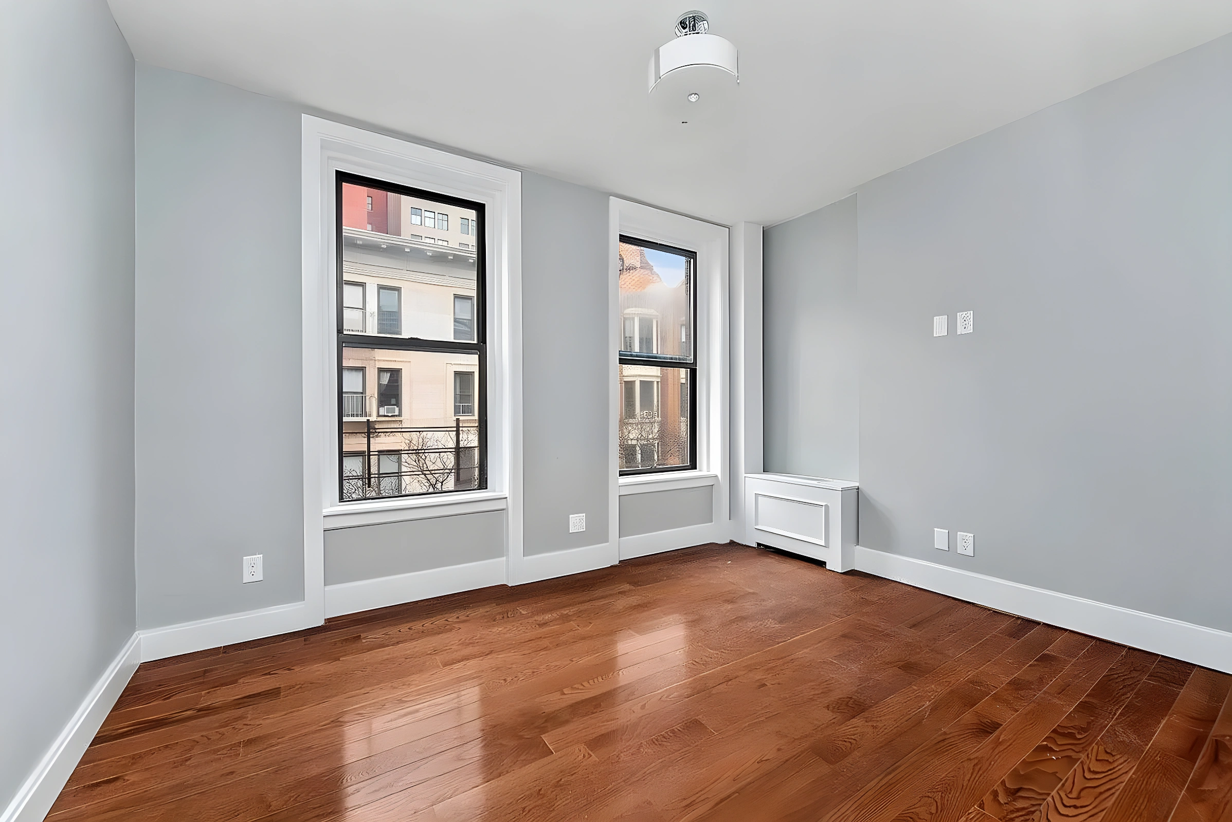 201 West 80th Street, Unit 4W Manhattan, NY 10024 - Photo 3 of 11 an empty room with windows