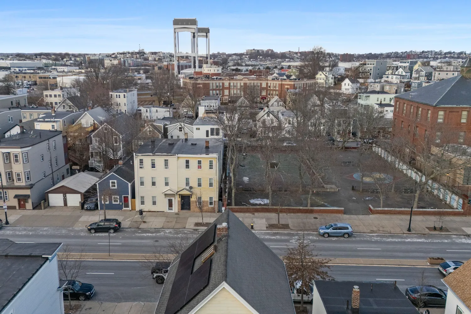 an aerial view of residential houses with outdoor space