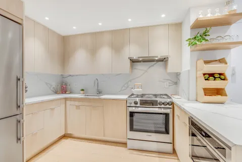 a kitchen with a stove and a sink