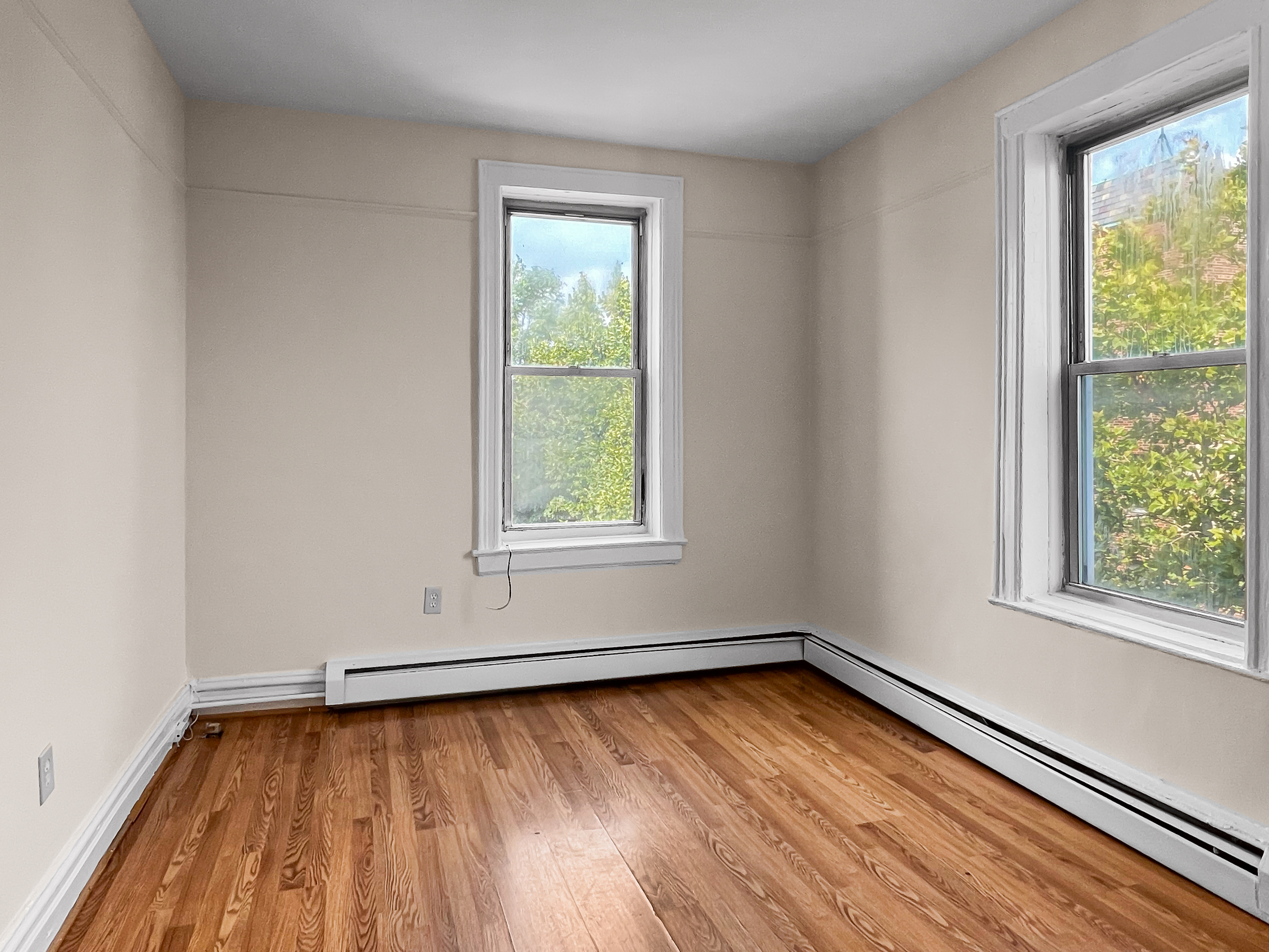 35-19 Broadway, Unit 3 Queens, NY 11106 - Photo 3 of 11 an empty room with a window