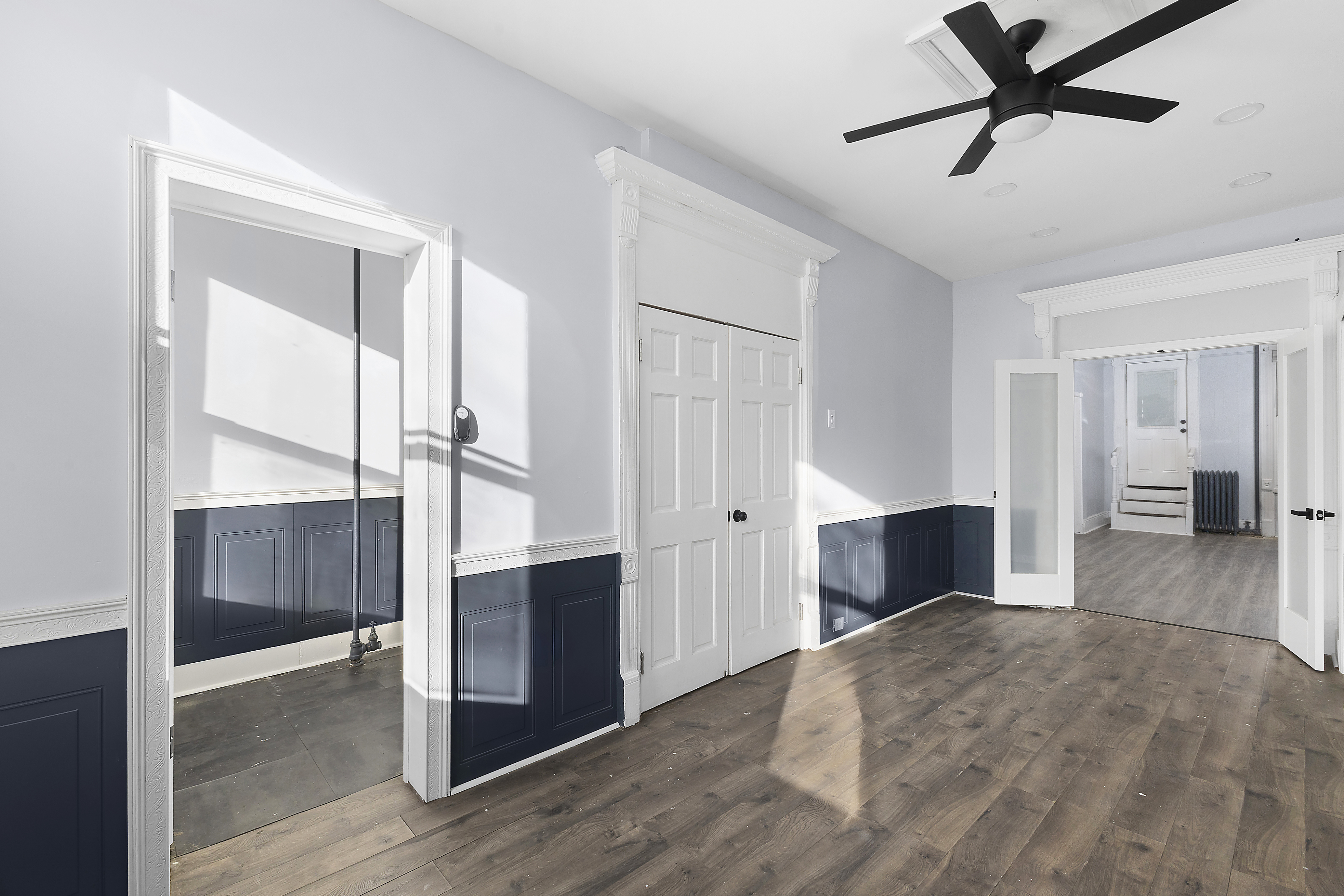 693 MacDonough Street, Unit 2 Brooklyn, NY 11233 - Photo 3 of 11 a view of hallway with bathroom and wooden floor