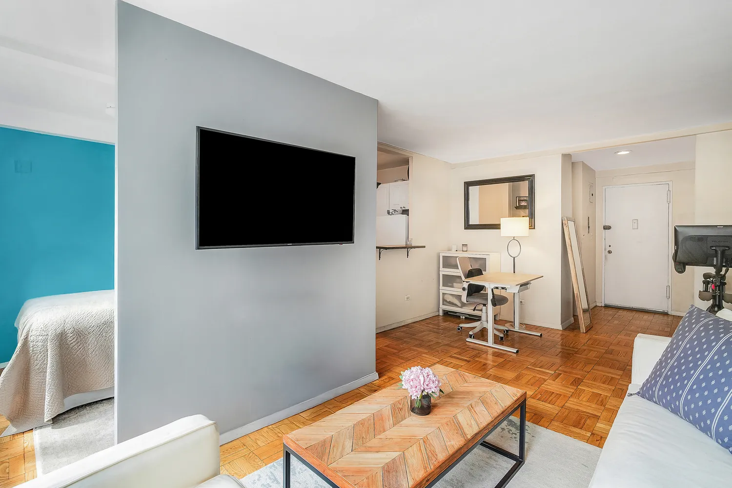 a living room with furniture and a flat screen tv
