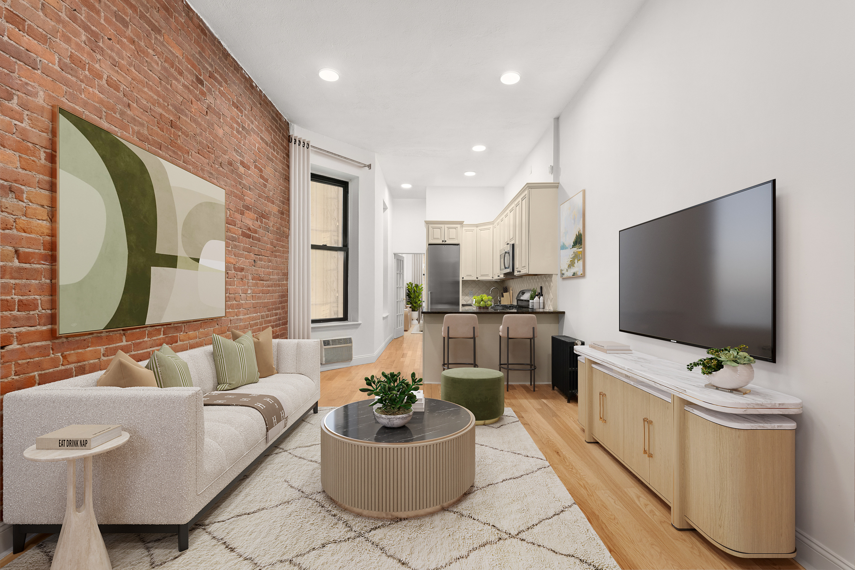 227 East 87th Street, Unit C Manhattan, NY 10128 - Photo 1 of 8 a living room with furniture and a flat screen tv