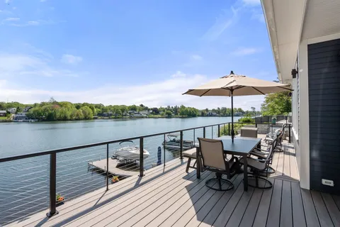 a view of a terrace with couches and wooden floor
