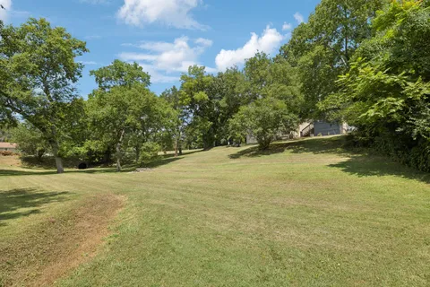 a view of a lake with a yard