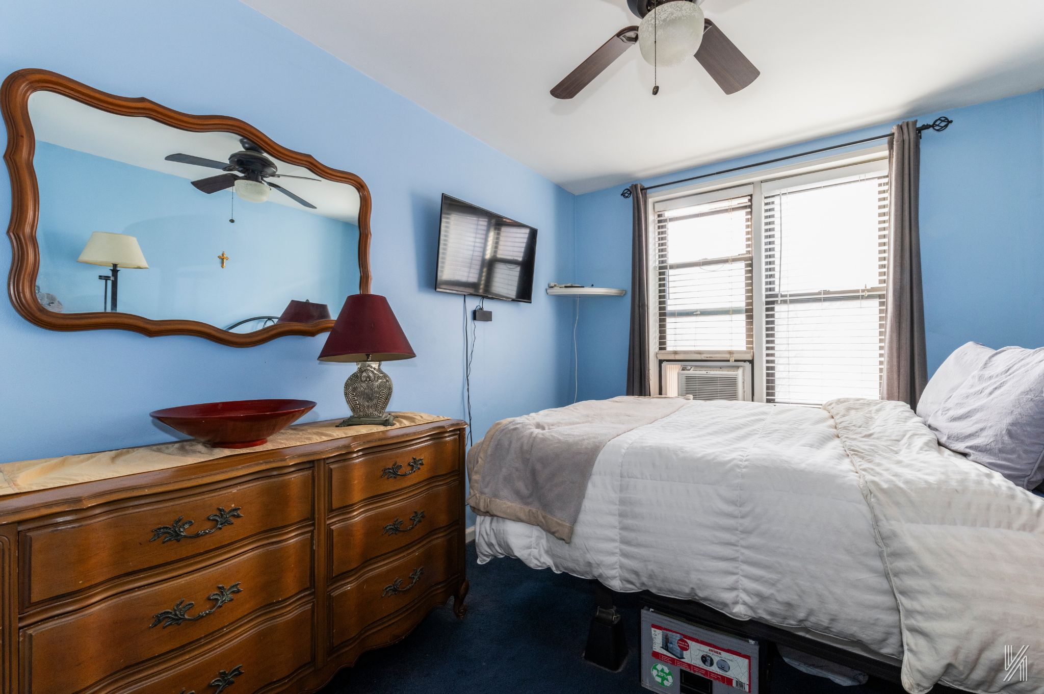 33-27 91st Street, Unit 3J Queens, NY 11372 - Photo 7 of 13 a bedroom with a bed and a window