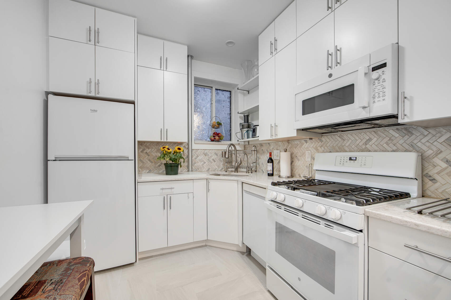 1878 Adam Clayton Powell Jr Boulevard, Unit 52 Manhattan, NY 10026 - Photo 3 of 13 a kitchen with cabinets appliances and a counter space