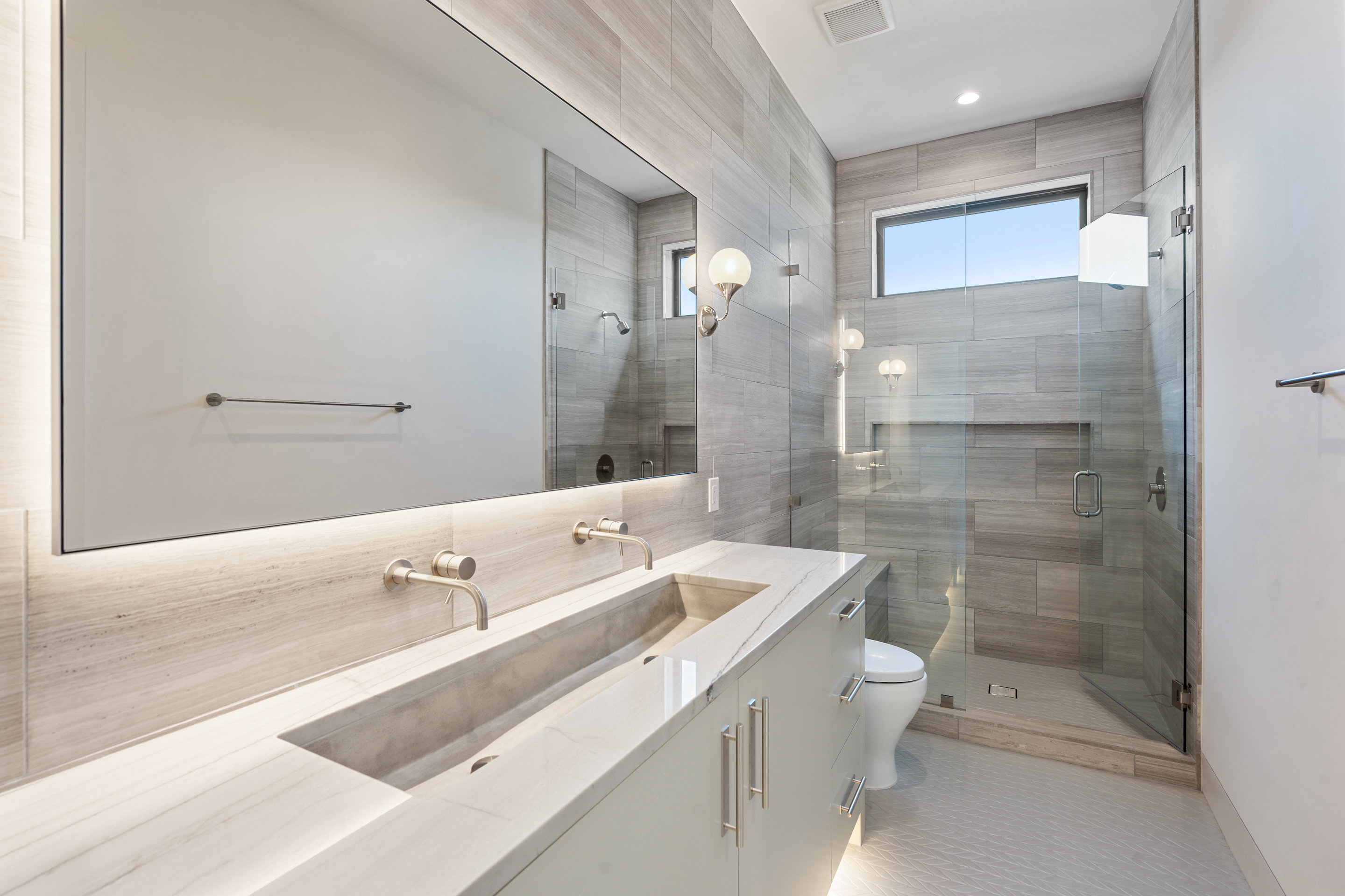 1905 Hallam Drive Austin, TX 78746 - Photo 29 of 39 a bathroom with a double vanity sink toilet and shower
