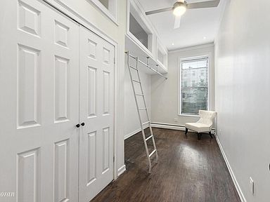 290 Hancock Street, Unit 1 Brooklyn, NY 11216 - Photo 3 of 6 a view of a room with racks on the wall and a window