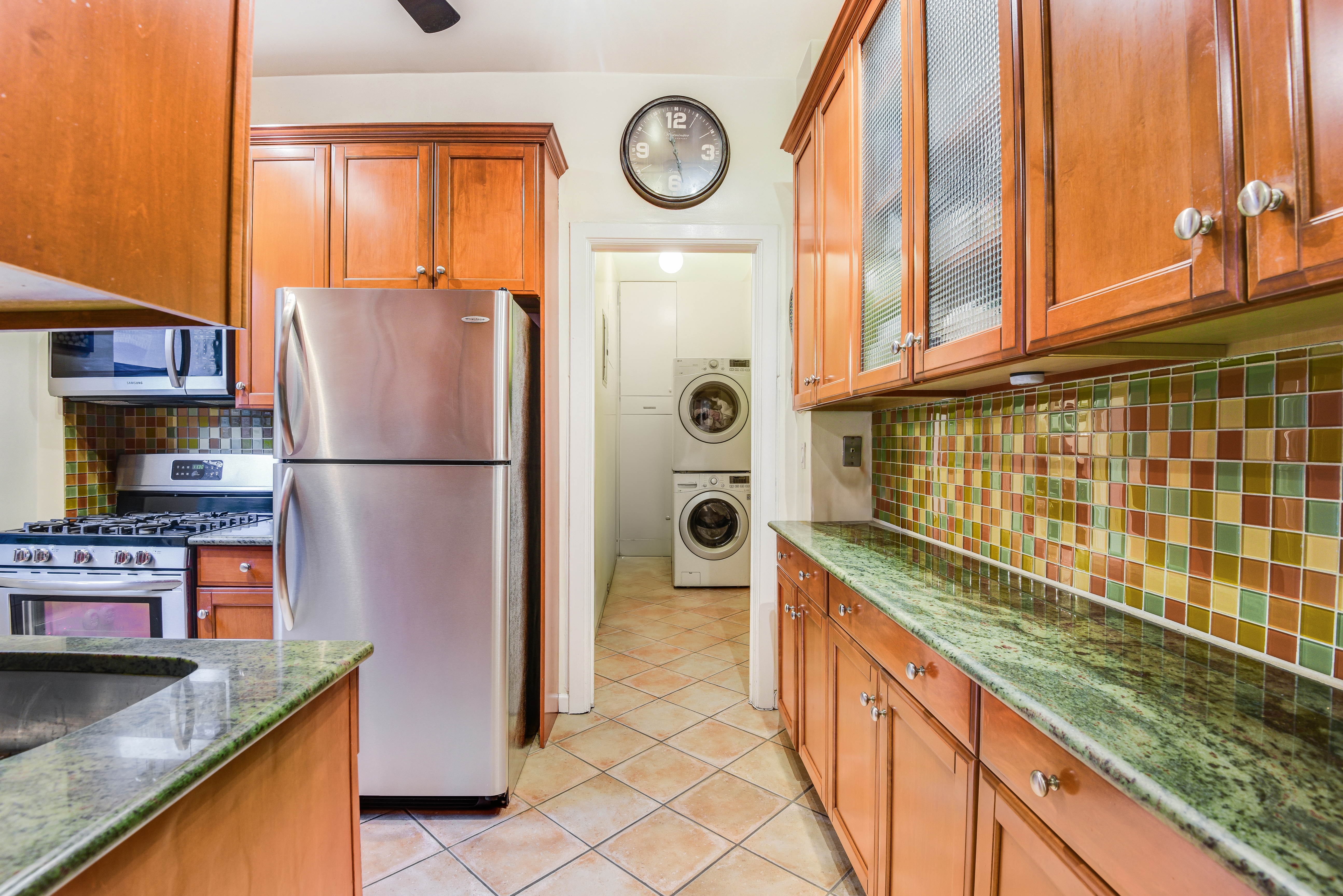 215 West 98th Street, Unit 8F Manhattan, NY 10025 - Photo 6 of 16 a kitchen with stainless steel appliances granite countertop a refrigerator a stove and a sink with granite countertops