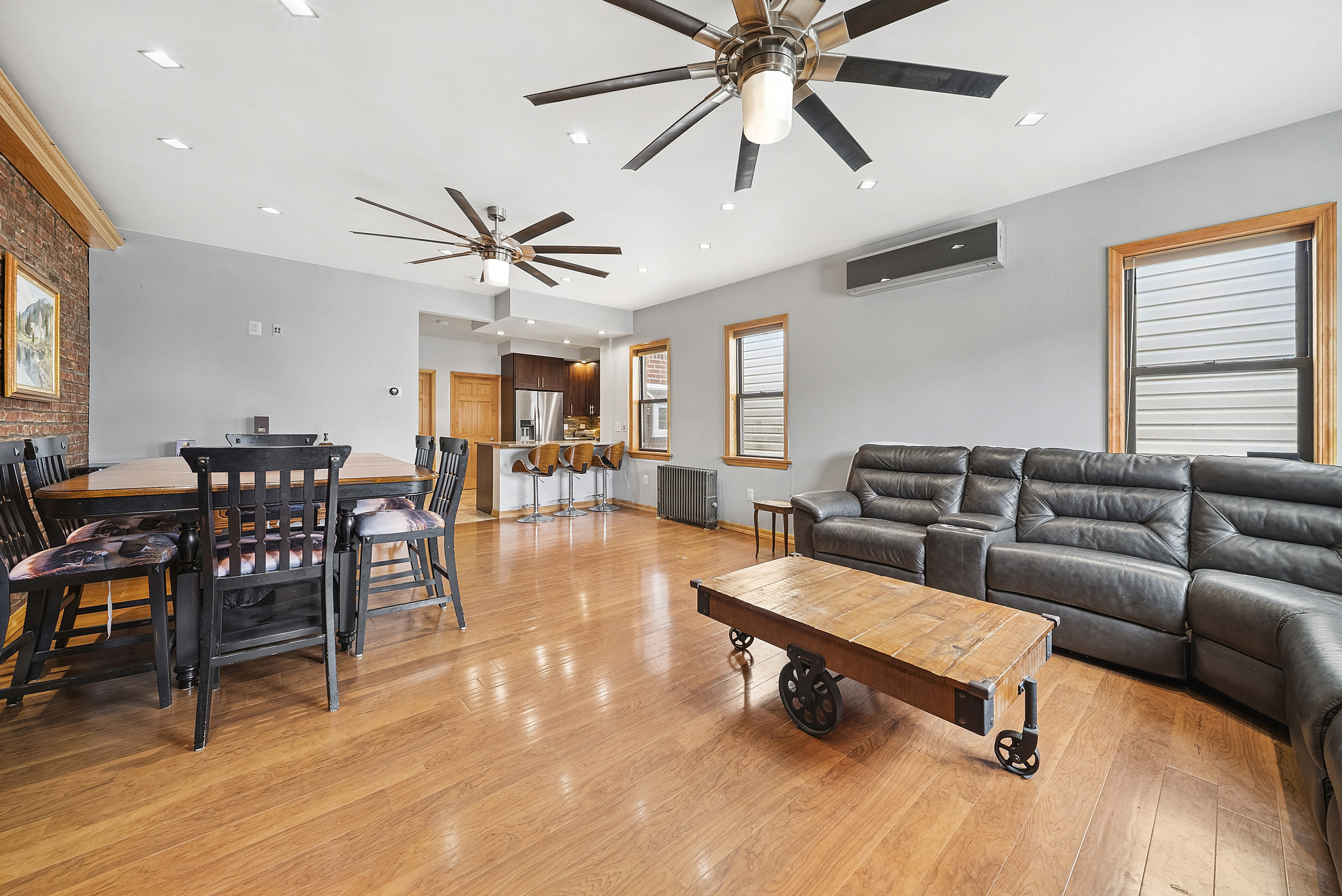 203 Battery Avenue Brooklyn, NY 11209 - Photo 4 of 14 a living room with furniture and wooden floor