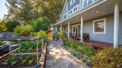 a view of an chair and table in the balcony