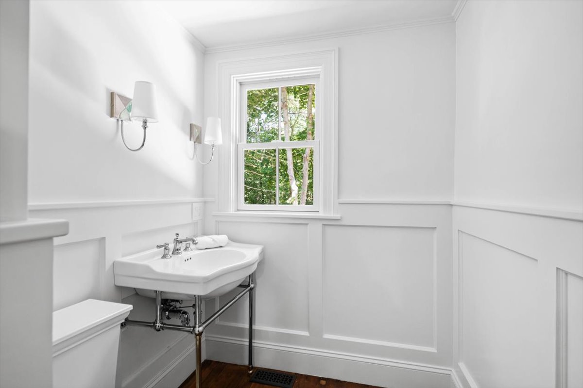 49 Garrison Road Hingham, MA 02043 - Photo 13 of 30 a bathroom with a sink a toilet and a window