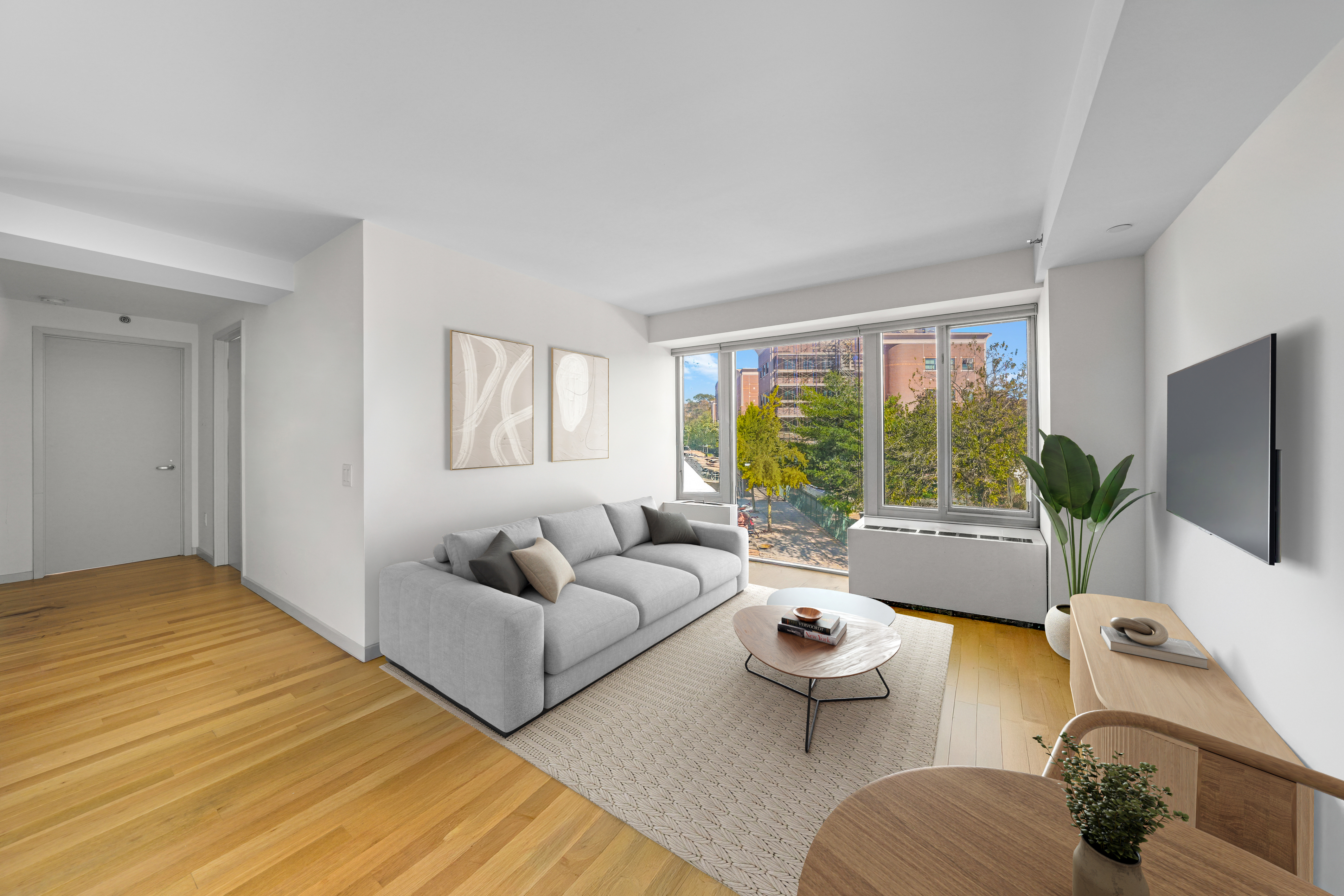 448 West 167th Street, Unit 3E Manhattan, NY 10032 - Photo 2 of 24 a living room with furniture and a flat screen tv