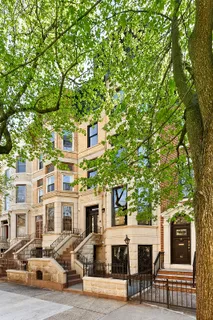 a front view of residential houses with yard
