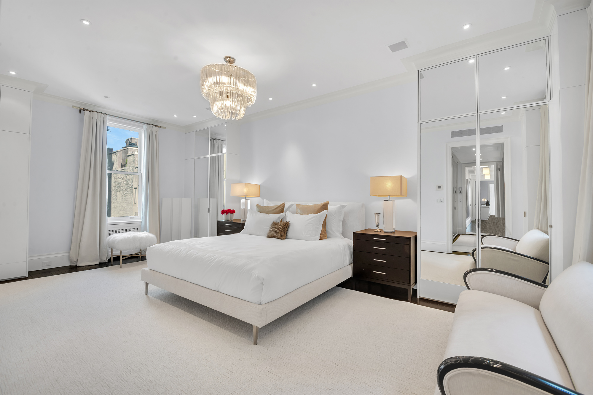 988 5th Avenue Manhattan, NY 10075 - Photo 10 of 14 a bedroom with bed and window