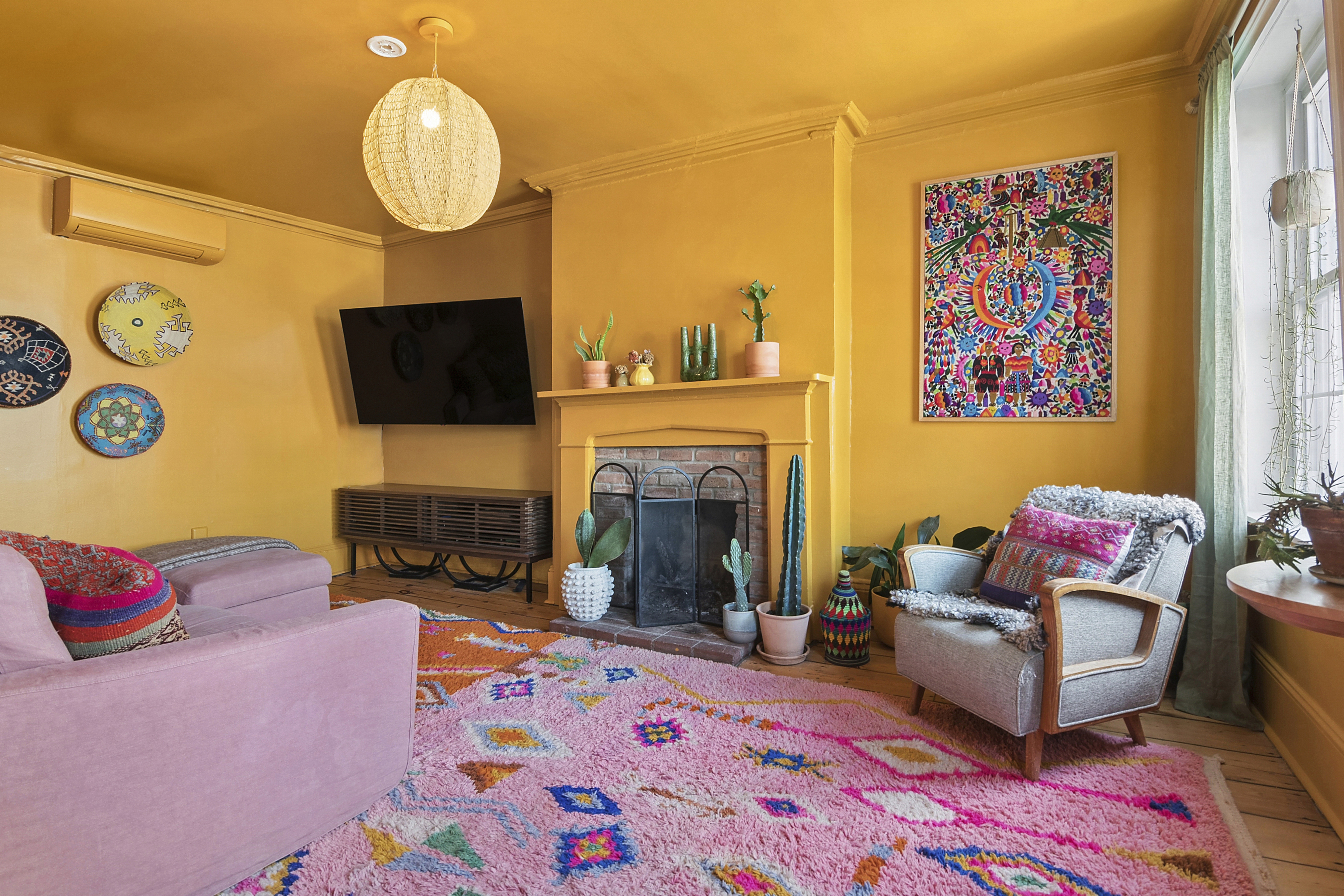 190 Concord Street Brooklyn, NY 11201 - Photo 3 of 14 a living room with furniture a flat screen tv and a fireplace