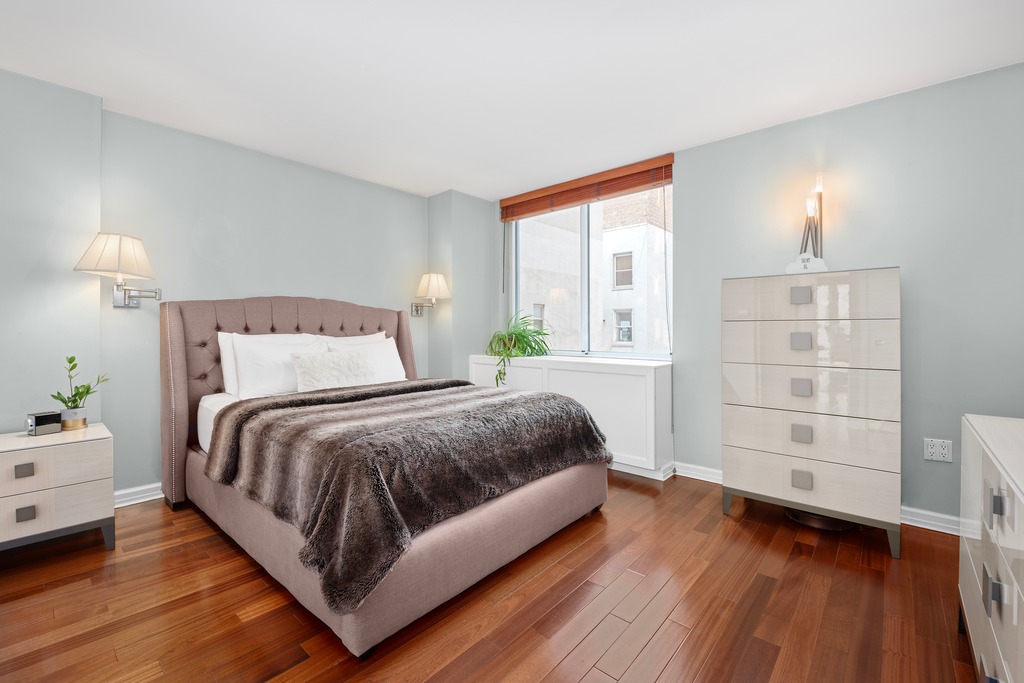 50 Lexington Avenue, Unit 4H Manhattan, NY 10010 - Photo 5 of 13 a spacious bedroom with a bed and a wooden floor