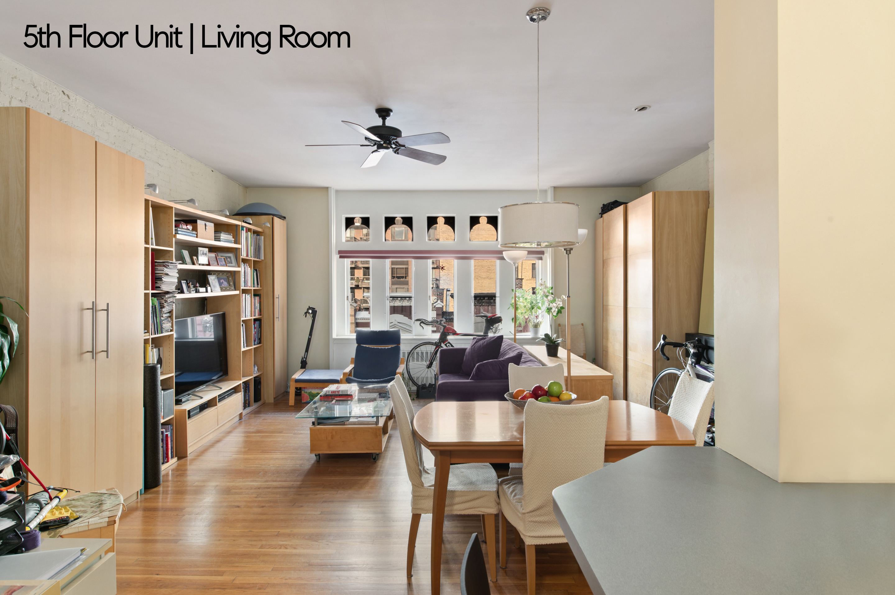 126 West 78th Street Manhattan, NY 10024 - Photo 24 of 39 a living room with furniture and a large window