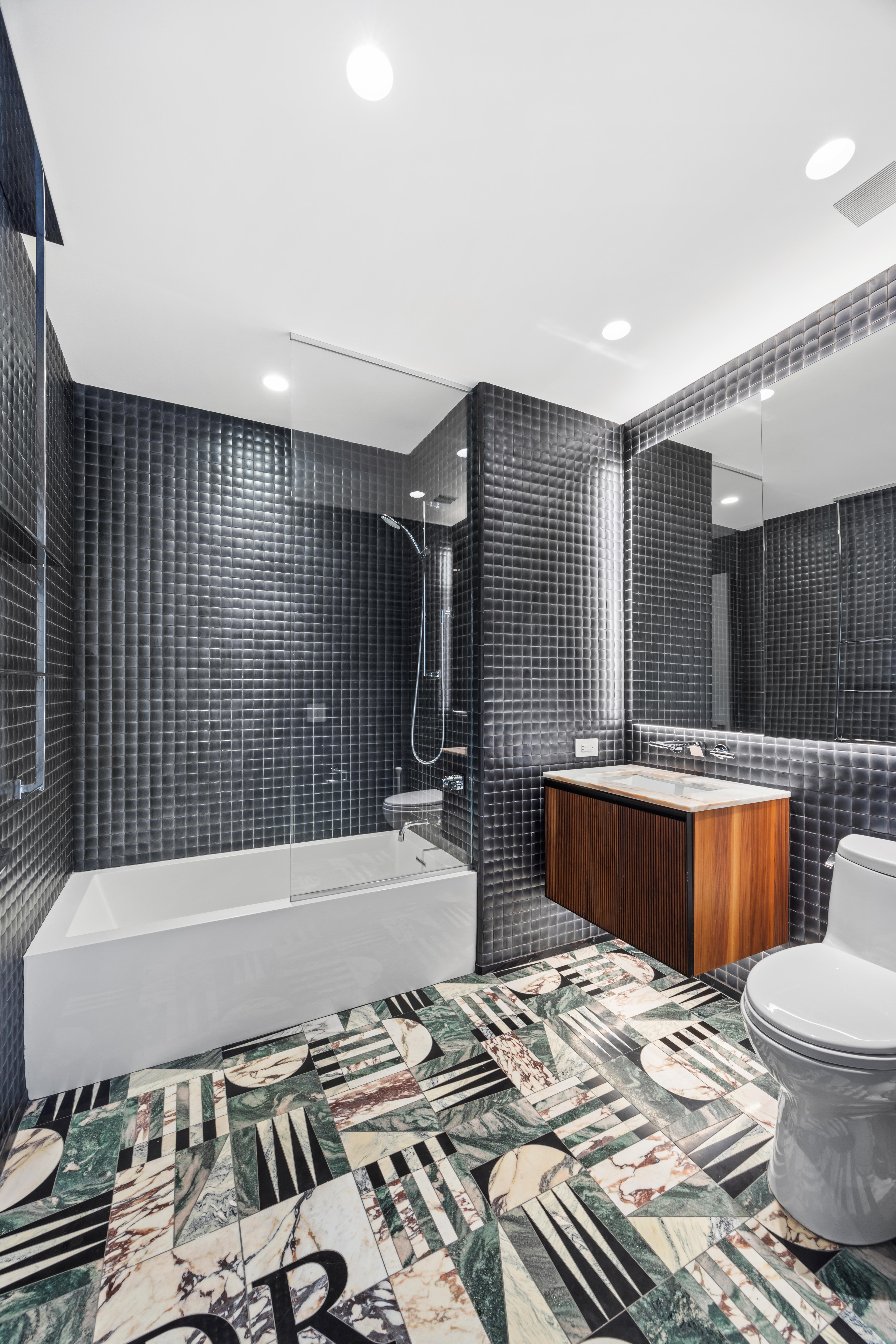 252 South Street, Unit 61A Manhattan, NY 10002 - Photo 8 of 29 a bathroom with a bathtub and toilet