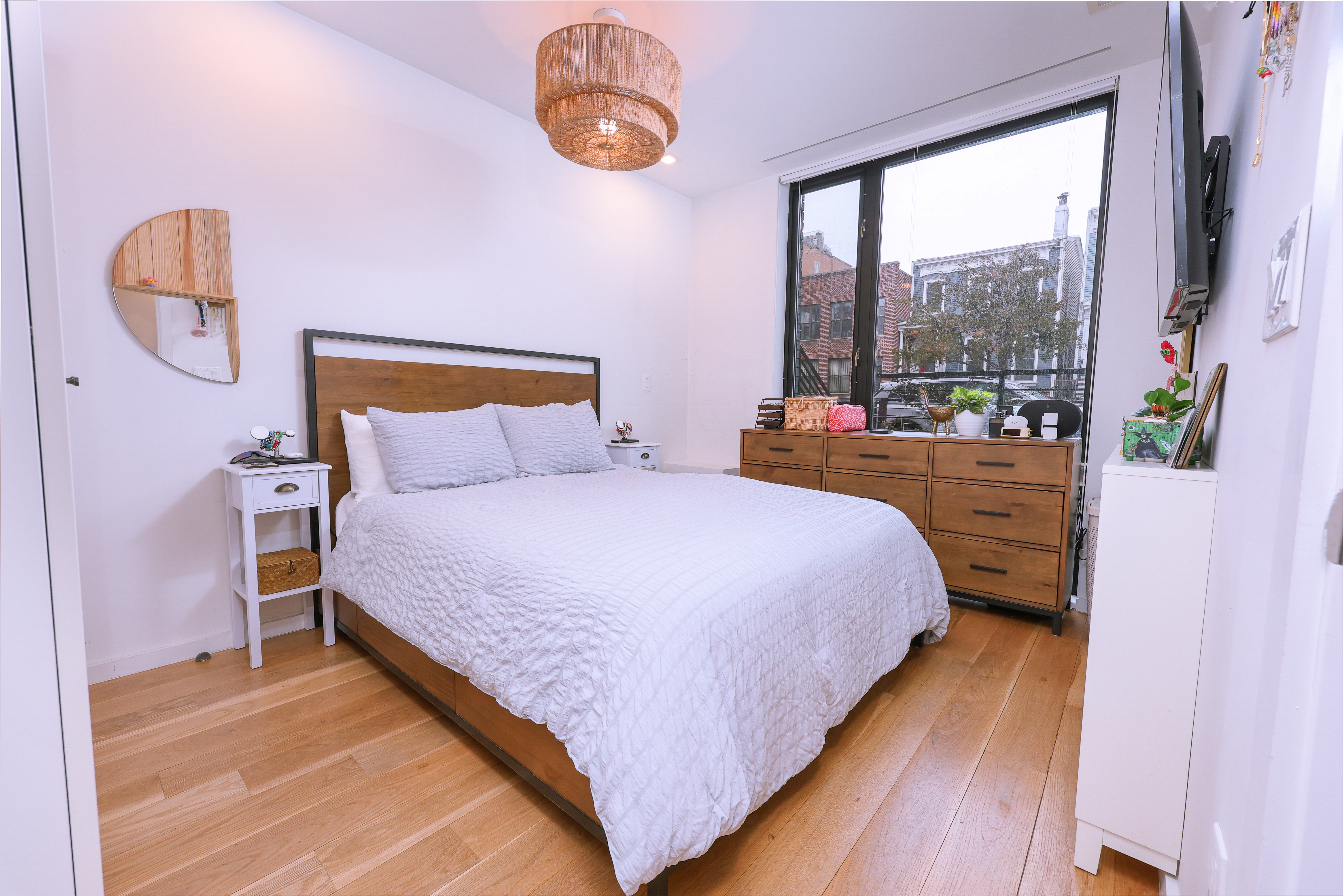 548 Lafayette Avenue, Unit 1A Brooklyn, NY 11205 - Photo 3 of 12 a bedroom with a bed and a window