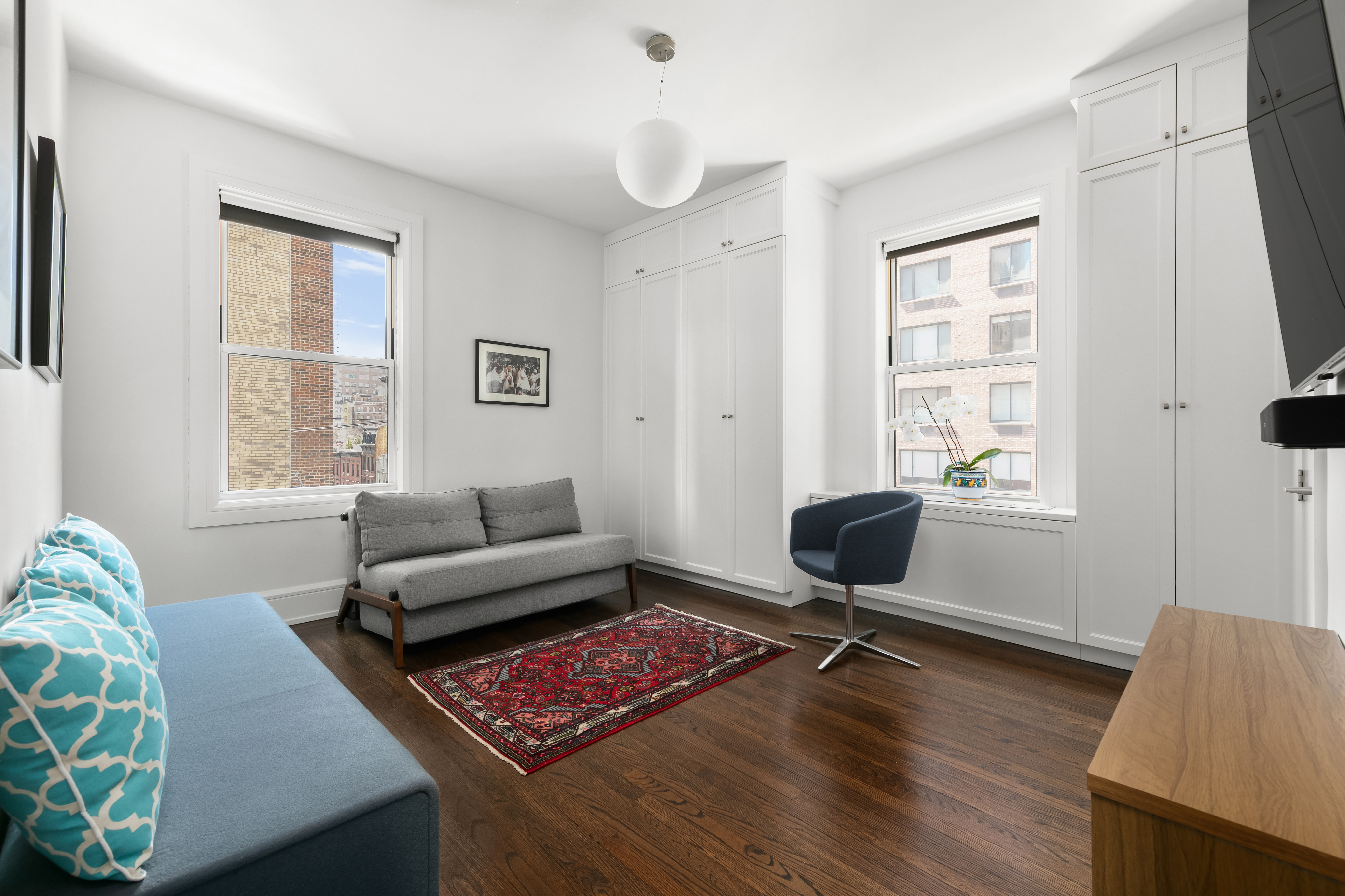 150 East 93rd Street, Unit 6AC Manhattan, NY 10128 - Photo 6 of 17 a living room with furniture rug and window