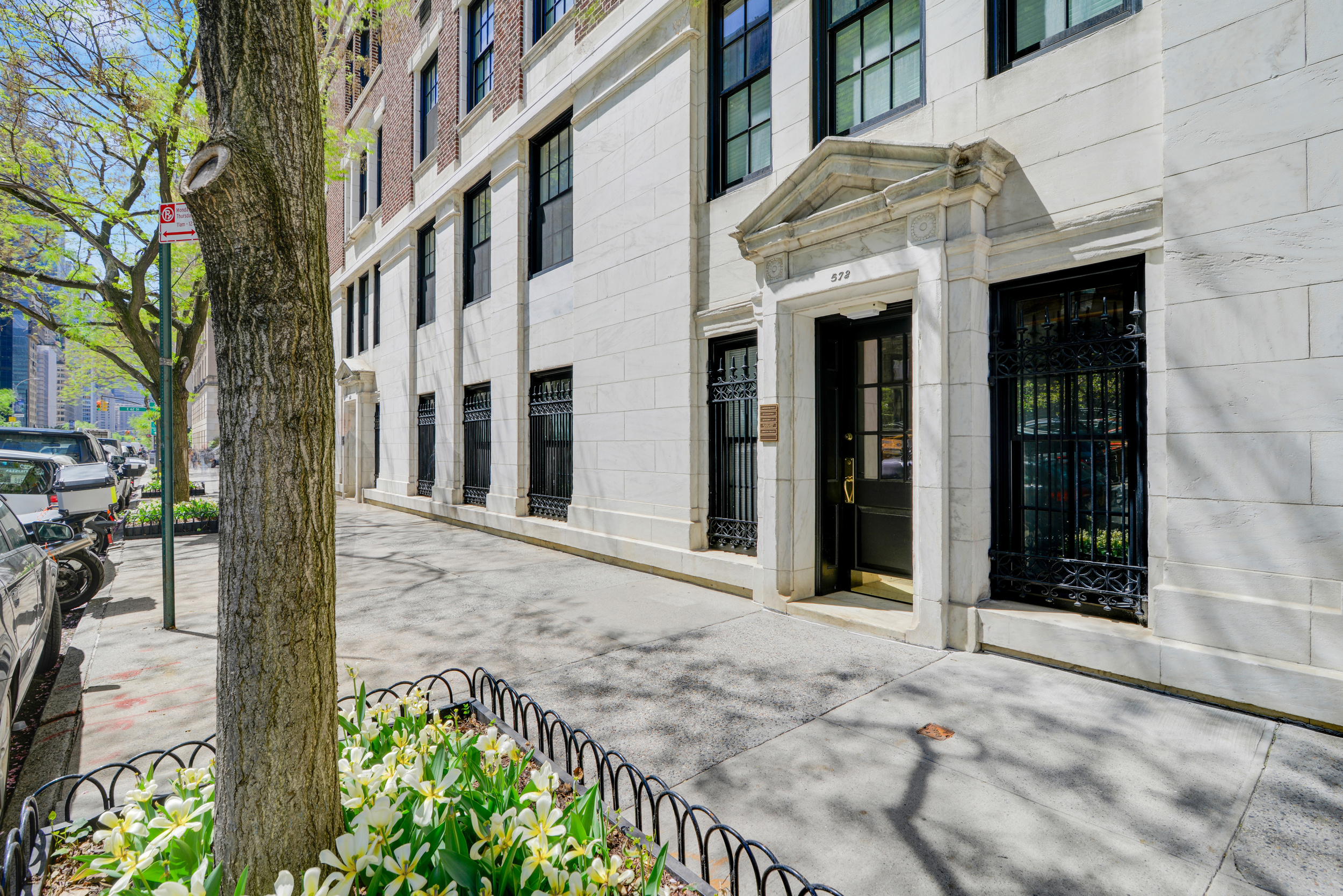 570 Park Avenue, Unit GROUND D Manhattan, NY 10065 - Photo 12 of 13 a view of a brick house with a large windows