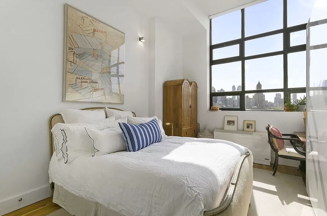 360 Furman Street, Unit 815 Brooklyn, NY 11201 - Photo 4 of 34 a bedroom with a bed and a window