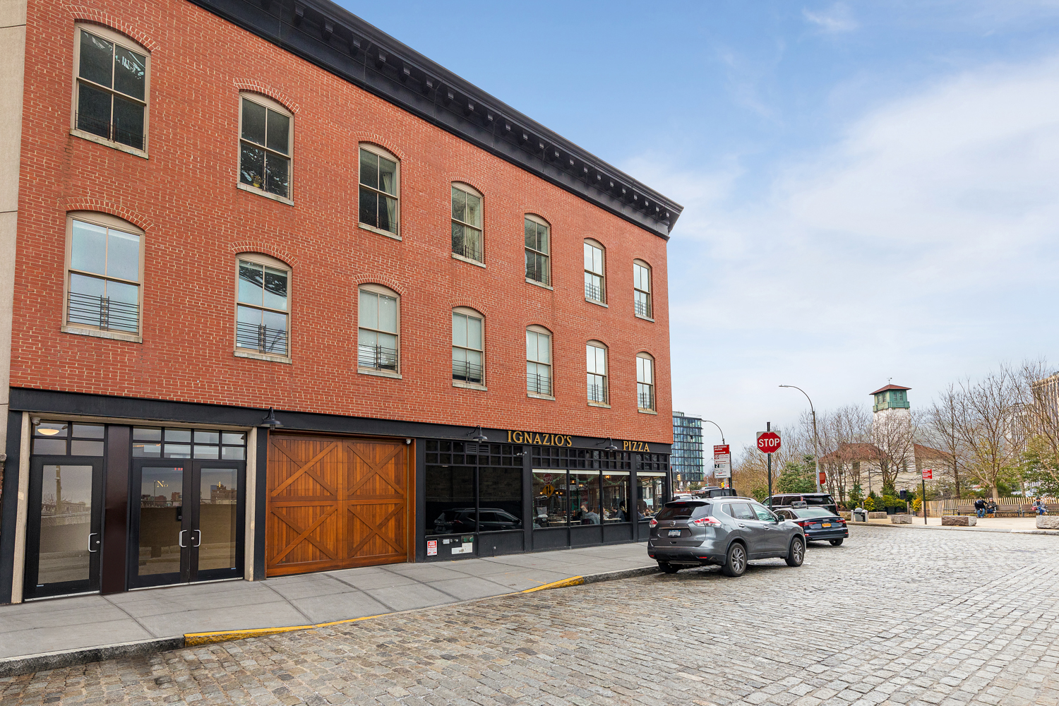 4 Water Street, Unit 2C Brooklyn, NY 11201 - Photo 14 of 21 a view of building with car parked