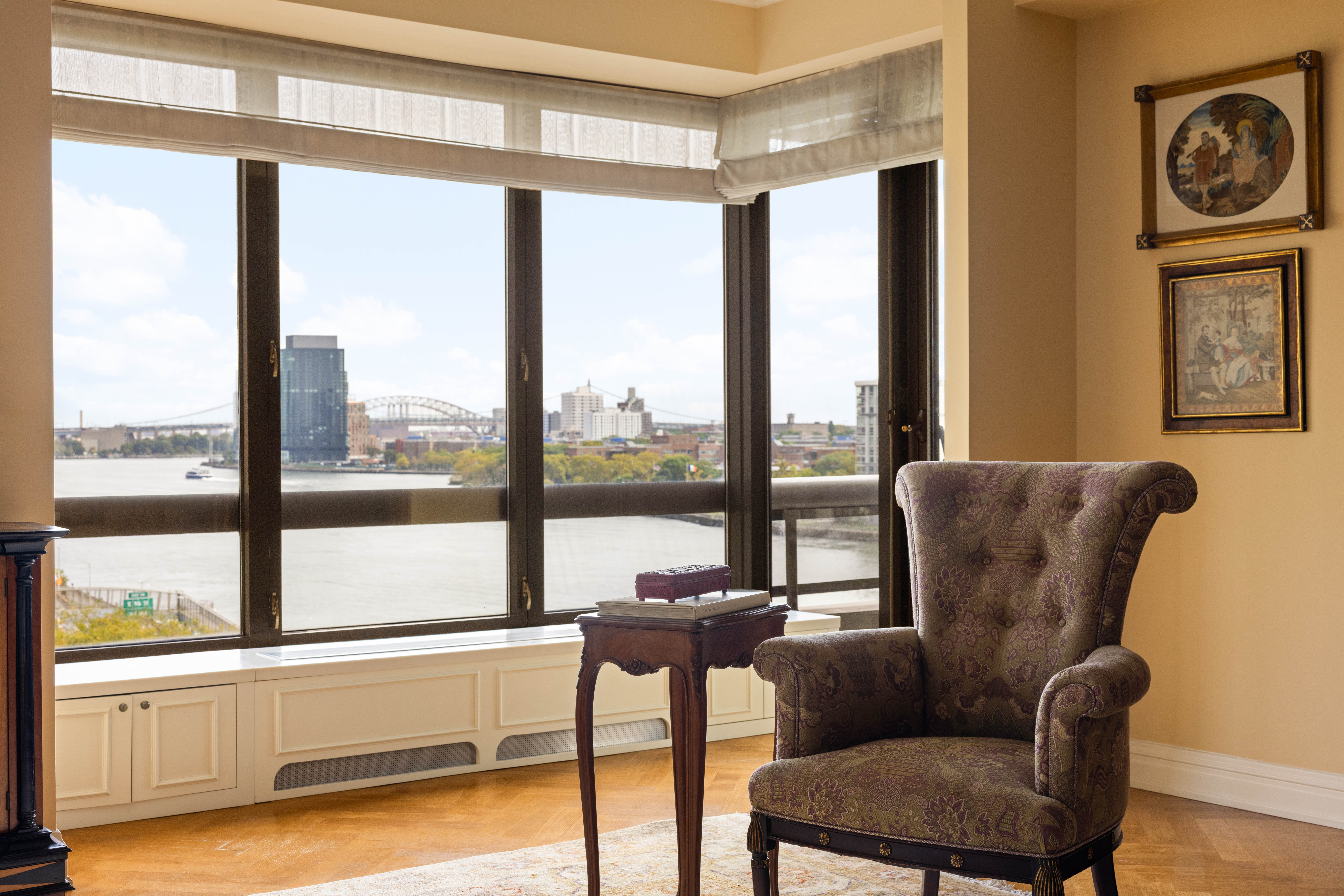 530 East 76th Street, Unit 8CD Manhattan, NY 10021 - Photo 4 of 21 a living room with furniture and a floor to ceiling window