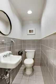 a bathroom with a toilet and a sink